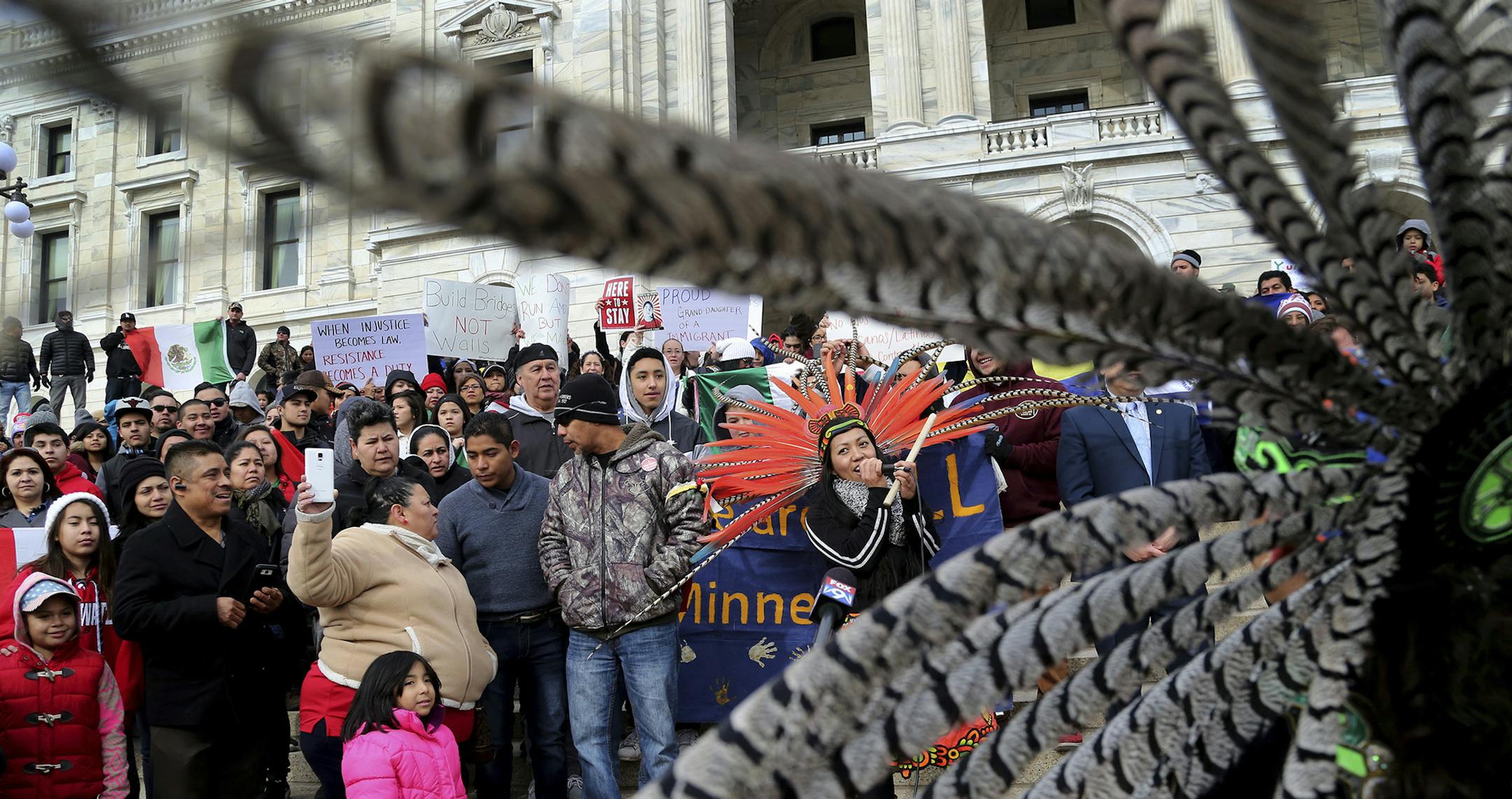 Participants in the "Day Without Immigrants," including members of Mexica Yolotl, a traditional Aztec group of Mexico-American dancers and drummers from the Twin Cities, fill the steps outside the Minnesota State Capitol Thursday, Feb. 16, 2017, in St. Paul, Minn. Immigrants around the U.S. stayed home from work and school Thursday to demonstrate how important they are to Americaís economy and way of life, and many businesses closed in solidarity, in a nationwide protest called A Day Withou