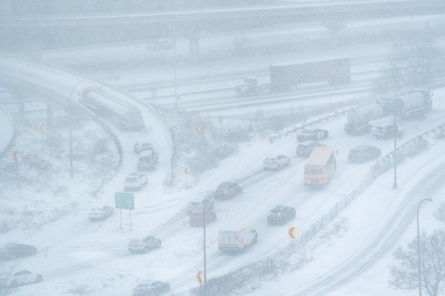 Two large trucks were trapped on the ramps to Interstates 94 and 394 in Tuesday's morning snowstorm in Minneapolis.
