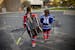 Mia Lang, 9, and Elisa Janzig de la Luz, 8, made their way to hockey practice at the Bloomington Ice Arena, Tuesday, September 22, 2020 in Bloomington