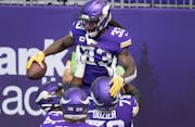 Minnesota Vikings running back Dalvin Cook (33) celebrated with teammates after scoring a touchdown in the first quarter. ] CARLOS GONZALEZ • cgonza