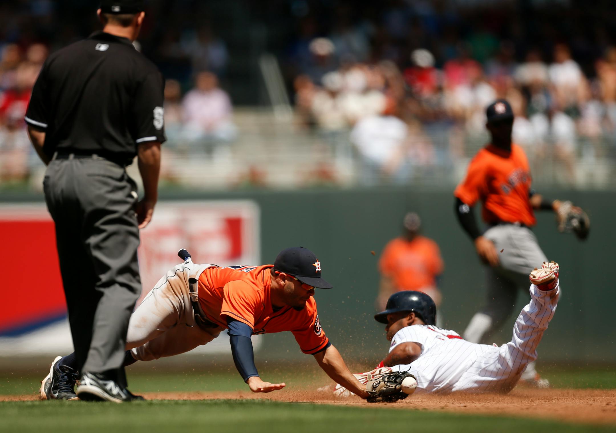 Minnesota's Danny Santana (39) went to second on a third-inning wild pitch Sunday afternoon at Target Field. The throw to Houston shortstop Jonathan Villar was off the mark.