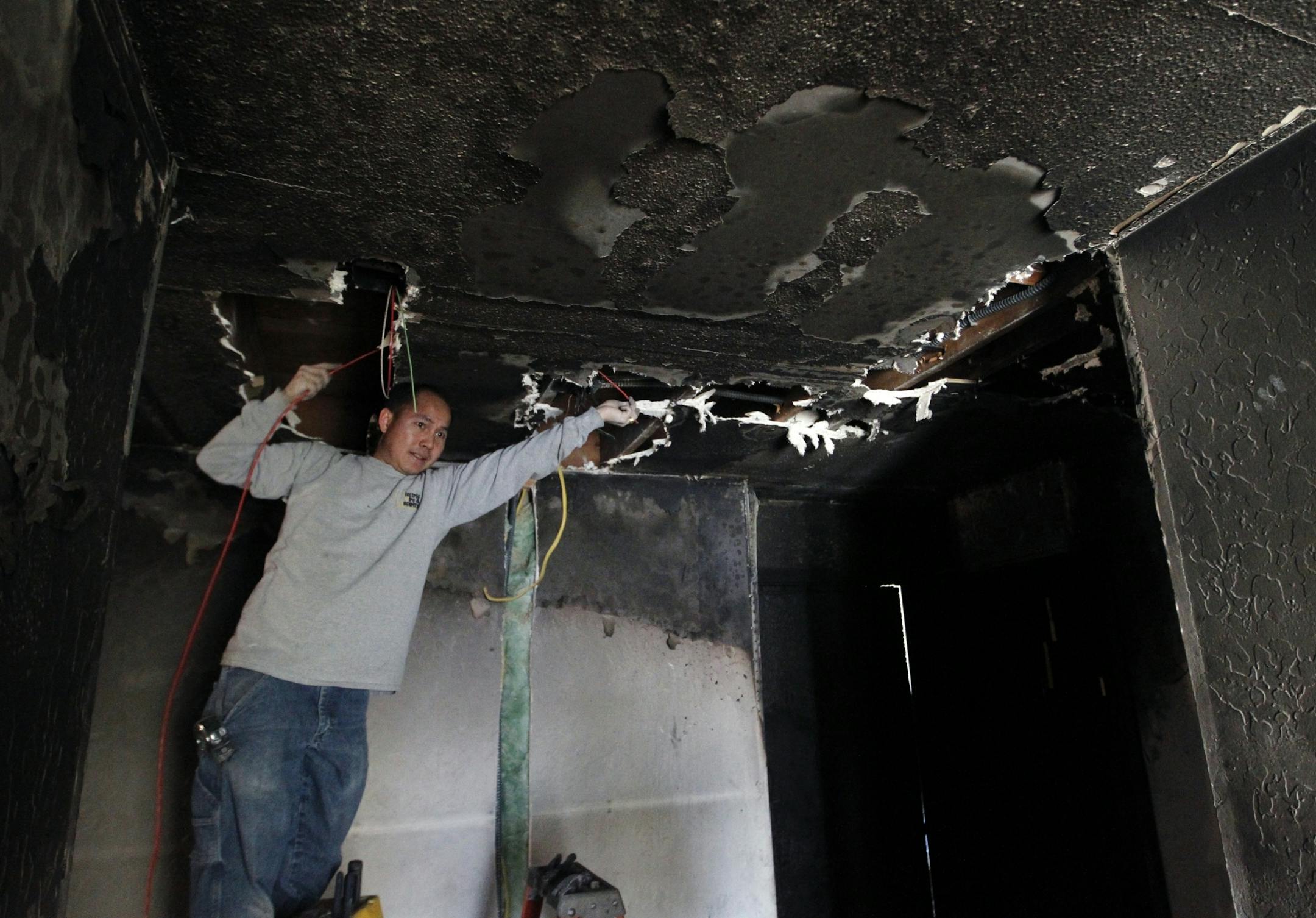 At the Willows Apartments in Brooklyn Park, a laundry room caught fire on the third floor. Electrician Vang Cheng Thao of Electric Fire & Security rewired the fire alarm system in the hallway and laundry room.