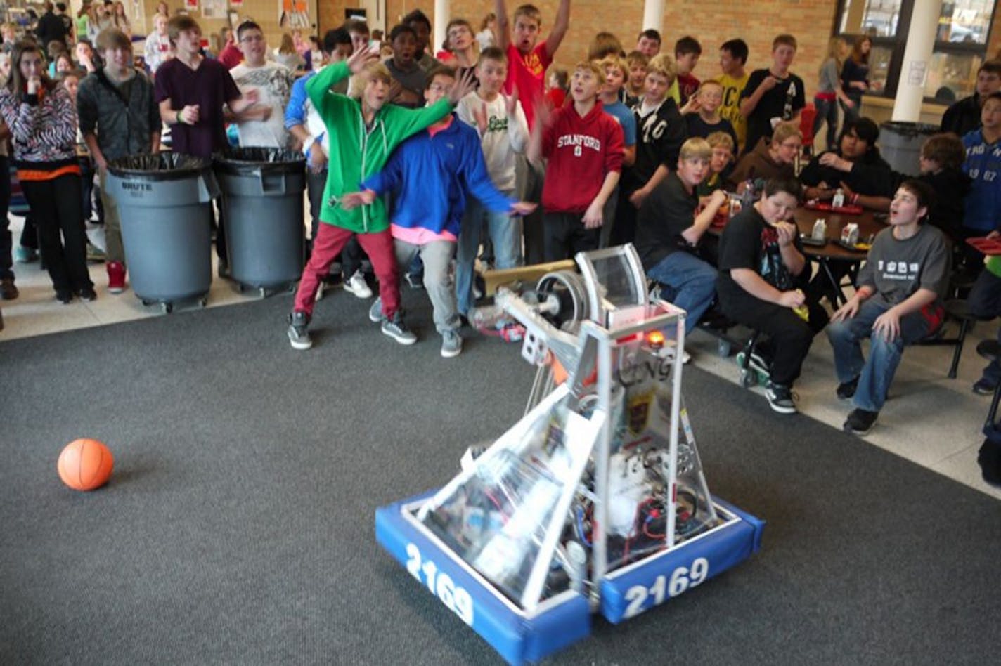 Demo at Belle Plaine with students playing with KING TeC�s robot shooting and catching balls. Photo provided by Belle Plaine school district