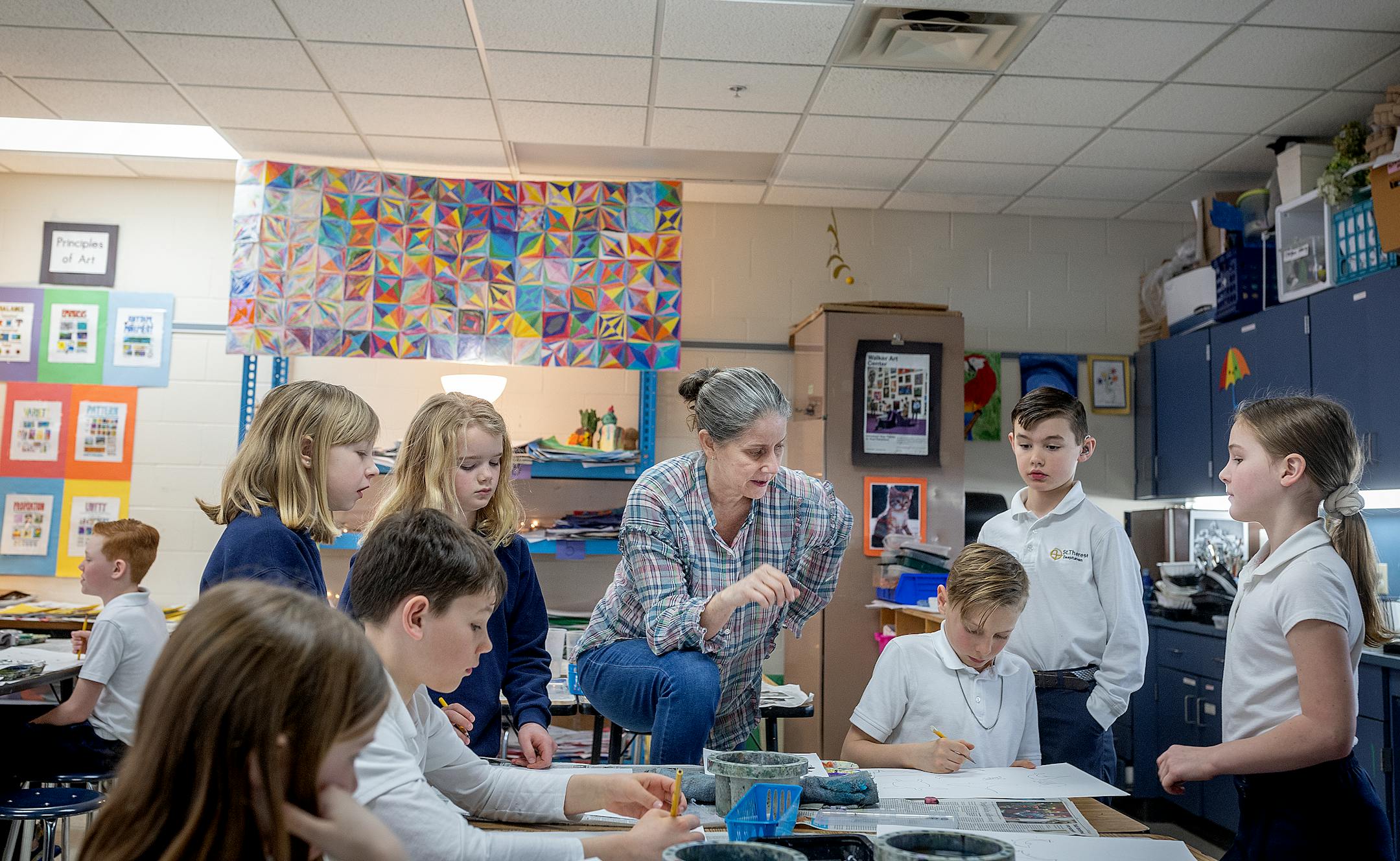 Teresa Peters worked with her students last week during her third grade art class at St. Therese Catholic School in Deephaven. As public school enrollment declines for the third consecutive year, private schools are continuing to grow.