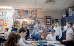 Teresa Peters worked with her students last week during her third grade art class at St. Therese Catholic School in Deephaven. As public school enroll