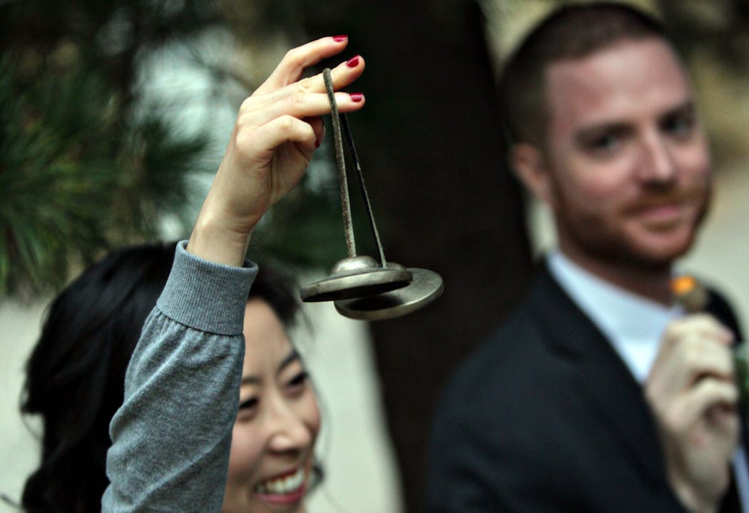 Family and friends rang bells to honor the new names of Allison and Mike Bell at their 2011 wedding in St. Paul.