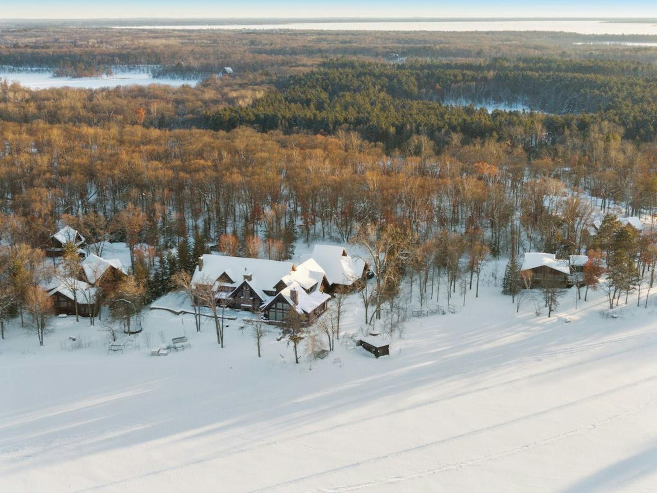 This compound on Cross Lake includes a main house and two adjacent guest houses, offered together for $5.85 million, or separately for $3.5 million, $1.25 million and $1.1 million.