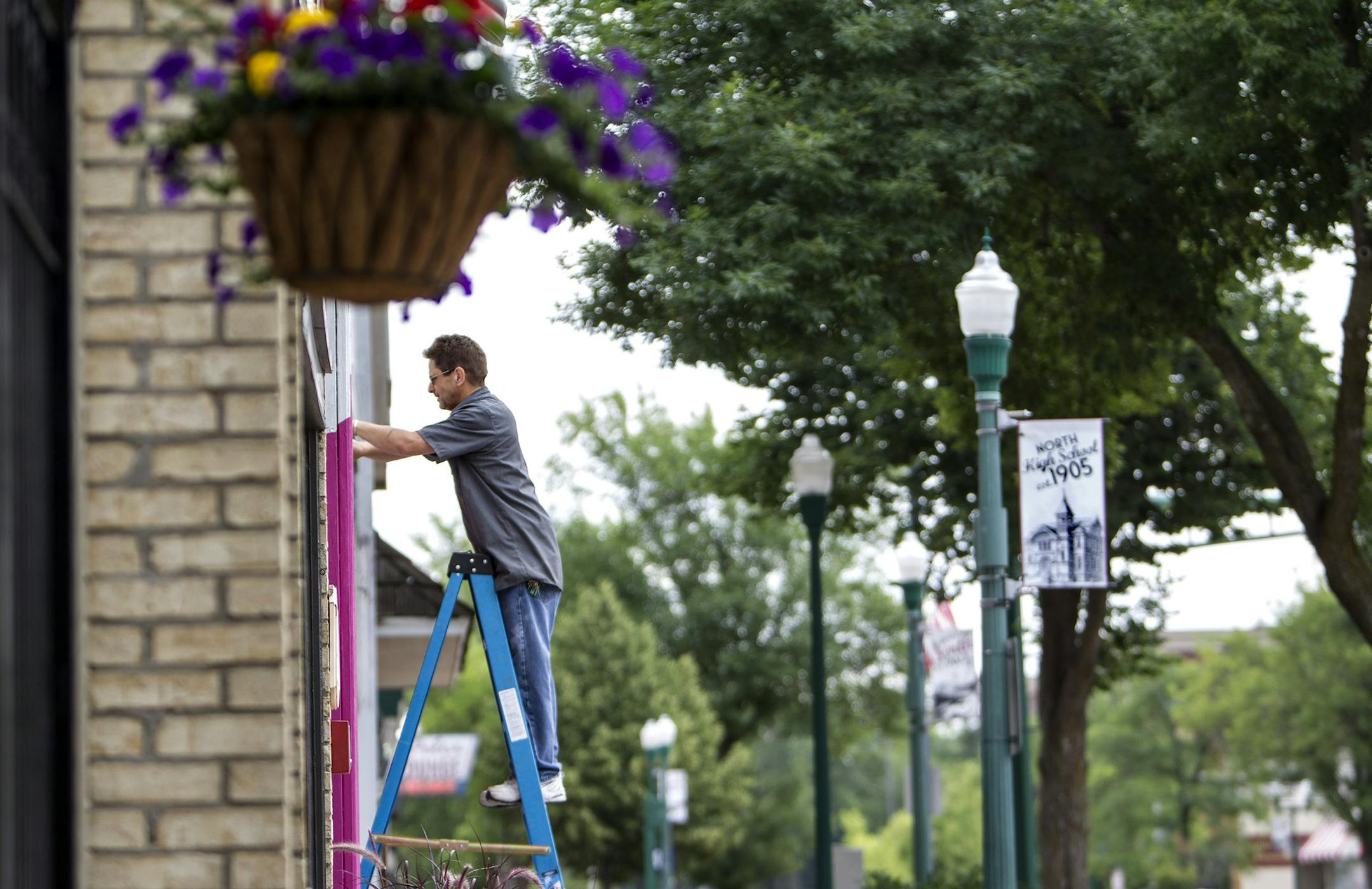 Maintenance technician Rob Kayo prepares a rental property for remodeling on 7th Avenue, North Saint Paul's old downtown, July 18, 2014. (Courtney Perry/Special to the Star Tribune)