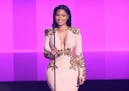 Nicki Minaj presents the award presents the award for favorite duo or group - pop/rock at the American Music Awards at the Microsoft Theater on Sunday