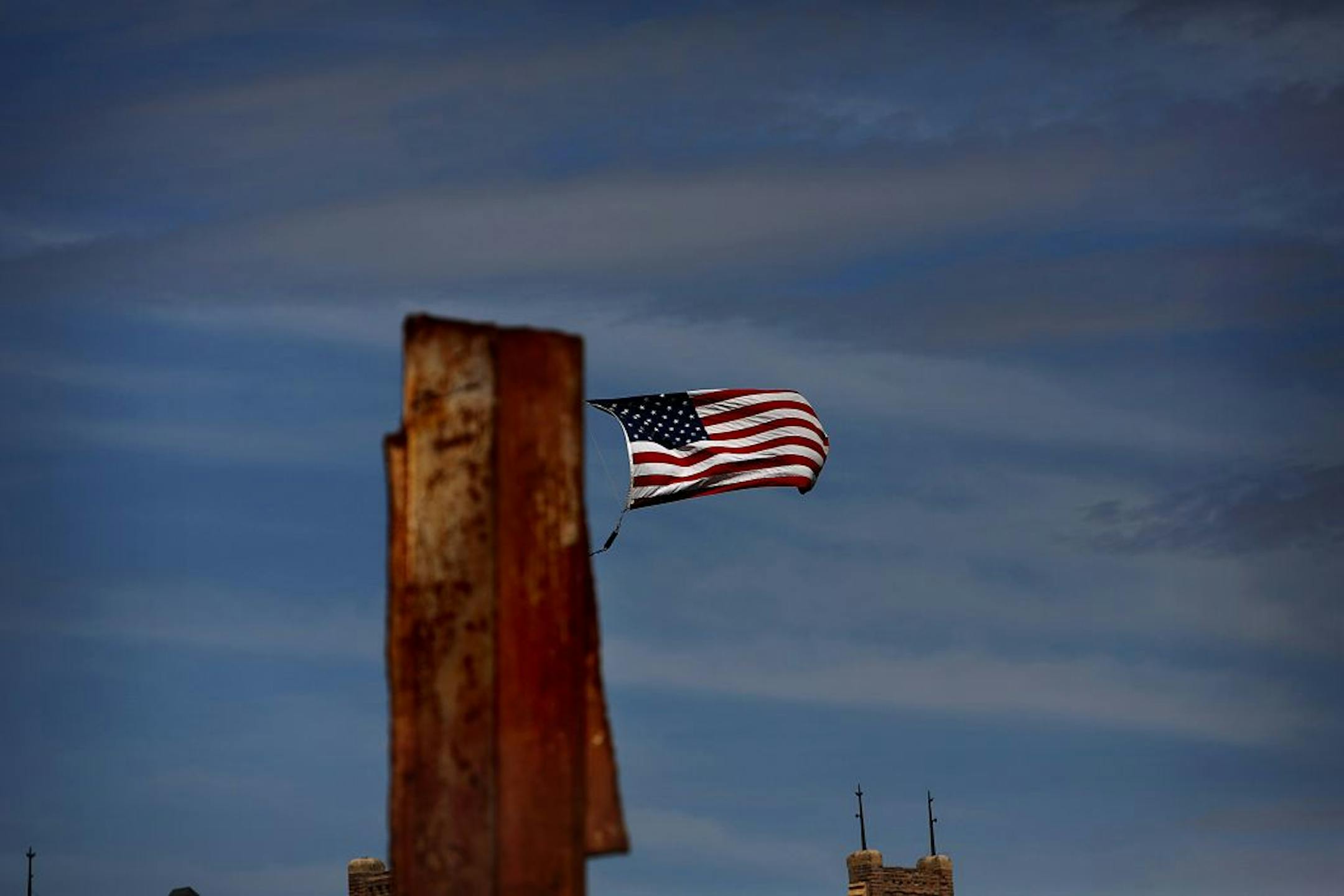 The 10-foot, 600-pound steel beam tilts 1-2 degrees toward New York City. There will be a prayer service at the memorial at 11:30 a.m. on Tuesday.