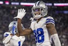 Cowboys wide receiver CeeDee Lamb (88) waved to the crowd to celebrate after Cowboys wide receiver Ced Wilson (1) ran for a 73-yard touchdown in the t