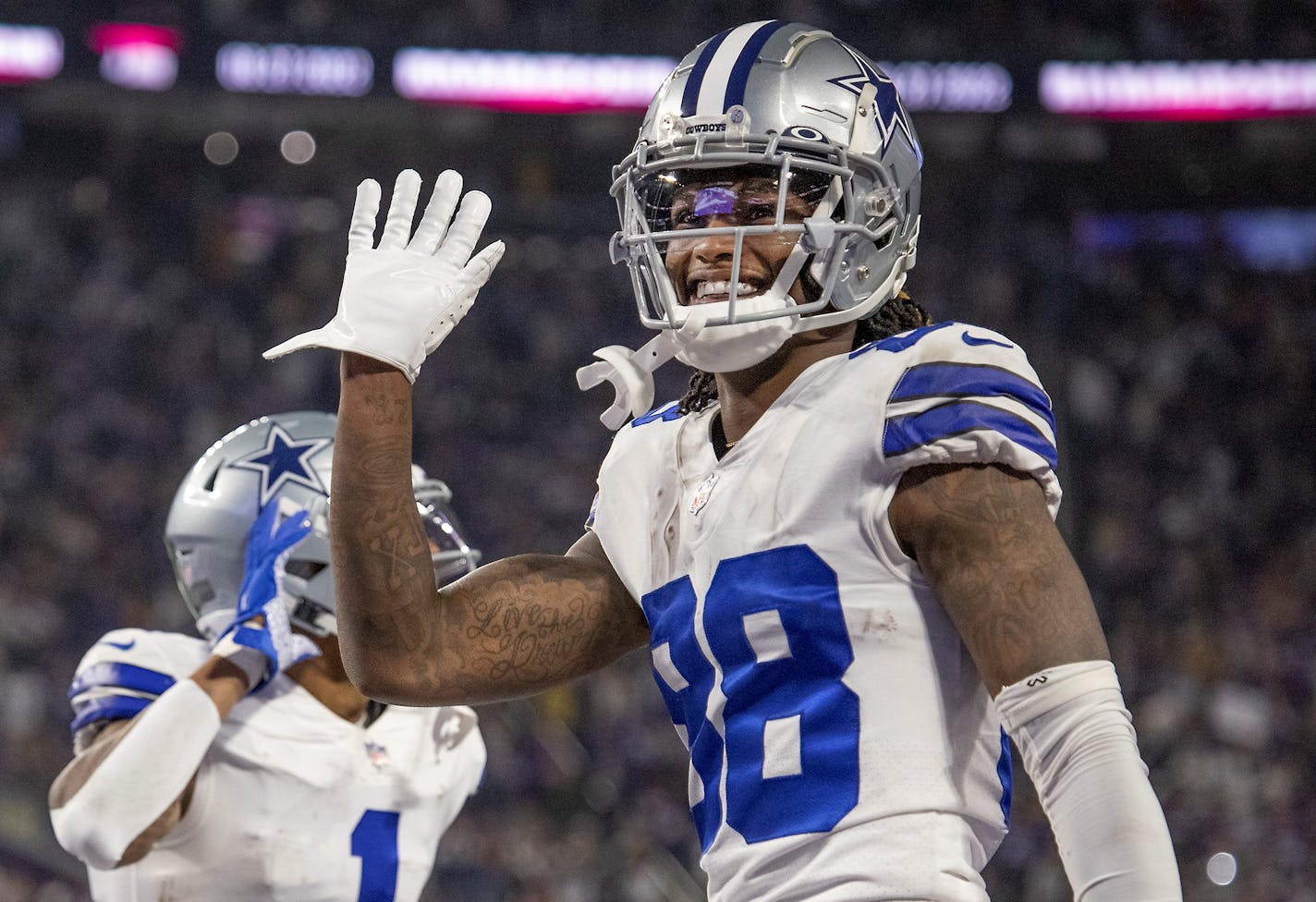 Cowboys wide receiver CeeDee Lamb (88) waved to the crowd to celebrate after Cowboys wide receiver Ced Wilson (1) ran for a 73-yard touchdown in the third quarter, Sunday, Oct. 31, 2021 in Minneapolis, Minn. The Minnesota Vikings hosted the Dallas Cowboys at U.S. Bank Stadium. ] ELIZABETH FLORES • liz.flores@startribune.com