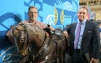 Craig Webb, Akron Beacon Journal Metro editor, poses with appraiser Brian Witherell and his mechanical horse on the set of the Antiques Roadshow 2015 