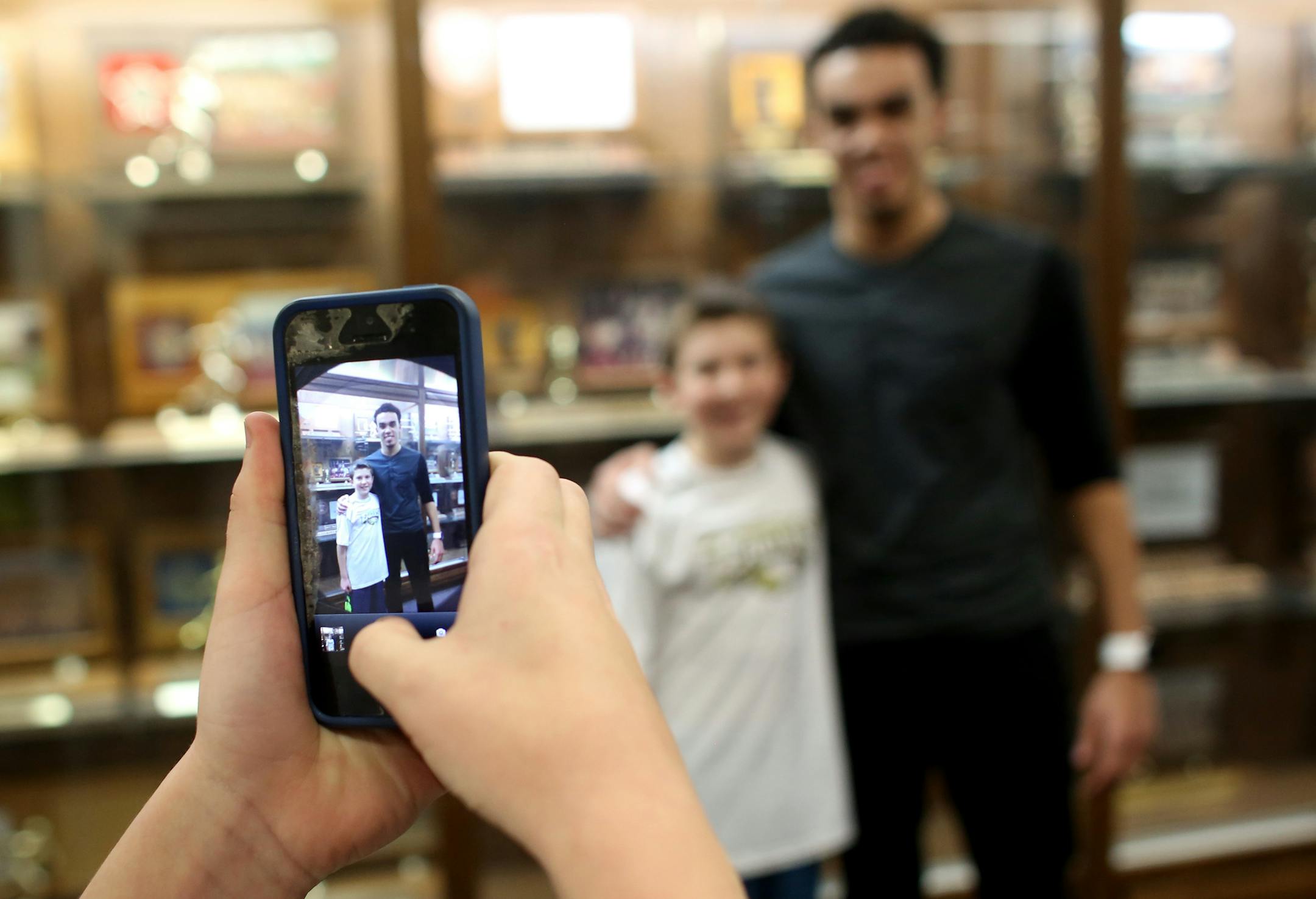 Sixth grade Apple Valley basketball player Nick DeLuca, 12, got his picture taken with Duke freshman Tyus Jones, who played for the Eagles as one of the nation's top recruits.