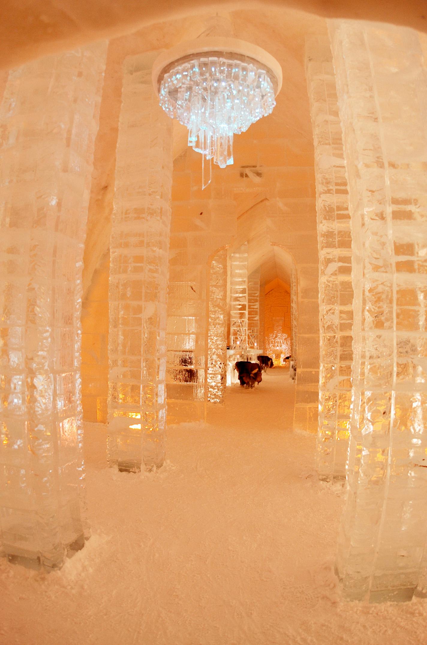 The Ice Hotel's gorgeous lobby sparkles under a fiber optic-lit candelabrum. More than 65,000 visitors pay about $15 (CAD) just to take a tour.