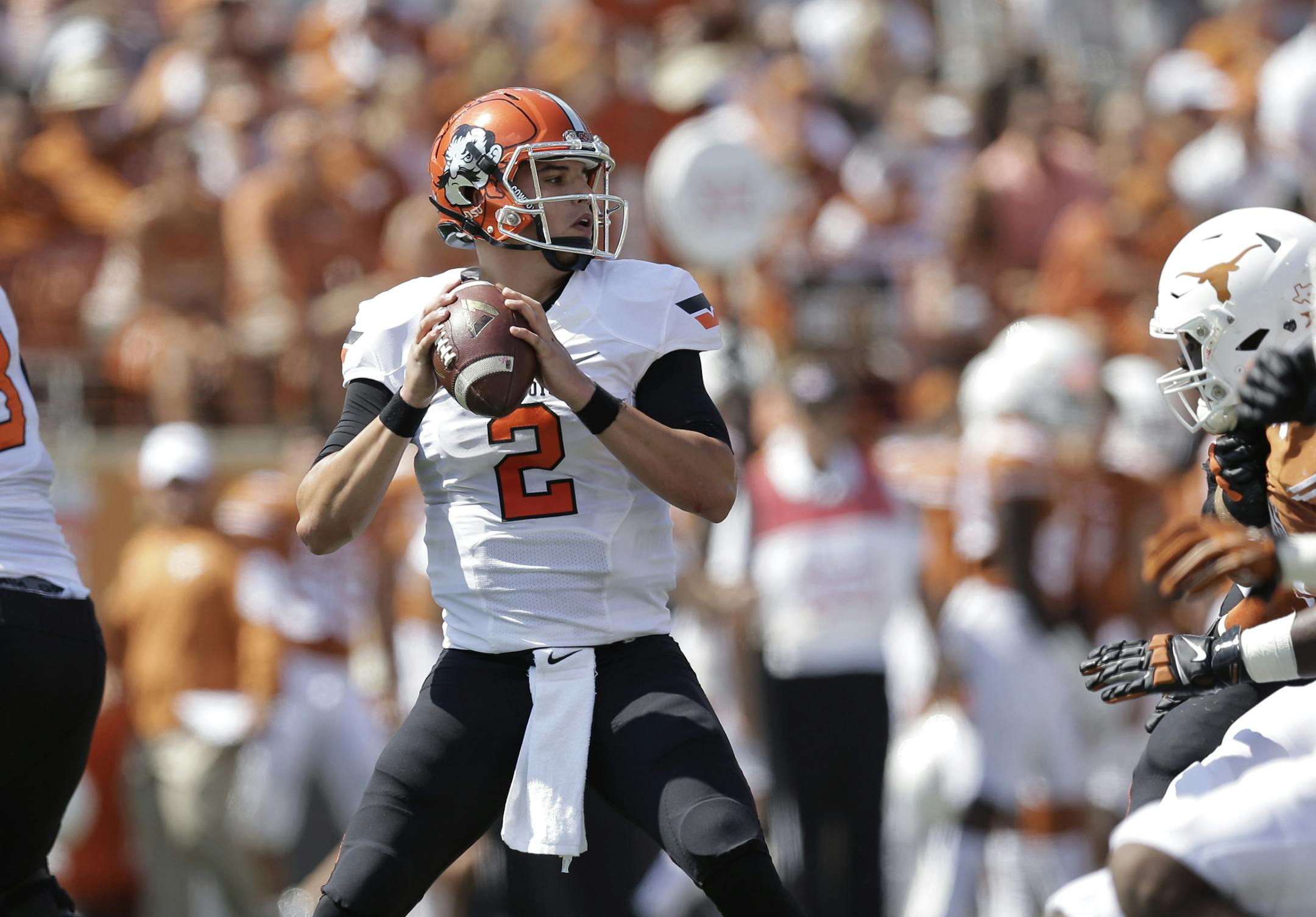 Oklahoma State's Mason Rudolph (2) throws against Texas during the first half of an NCAA college football game, Saturday, Sept. 26, 2015, in Austin, Texas. (AP Photo/Eric Gay) ORG XMIT: OTK