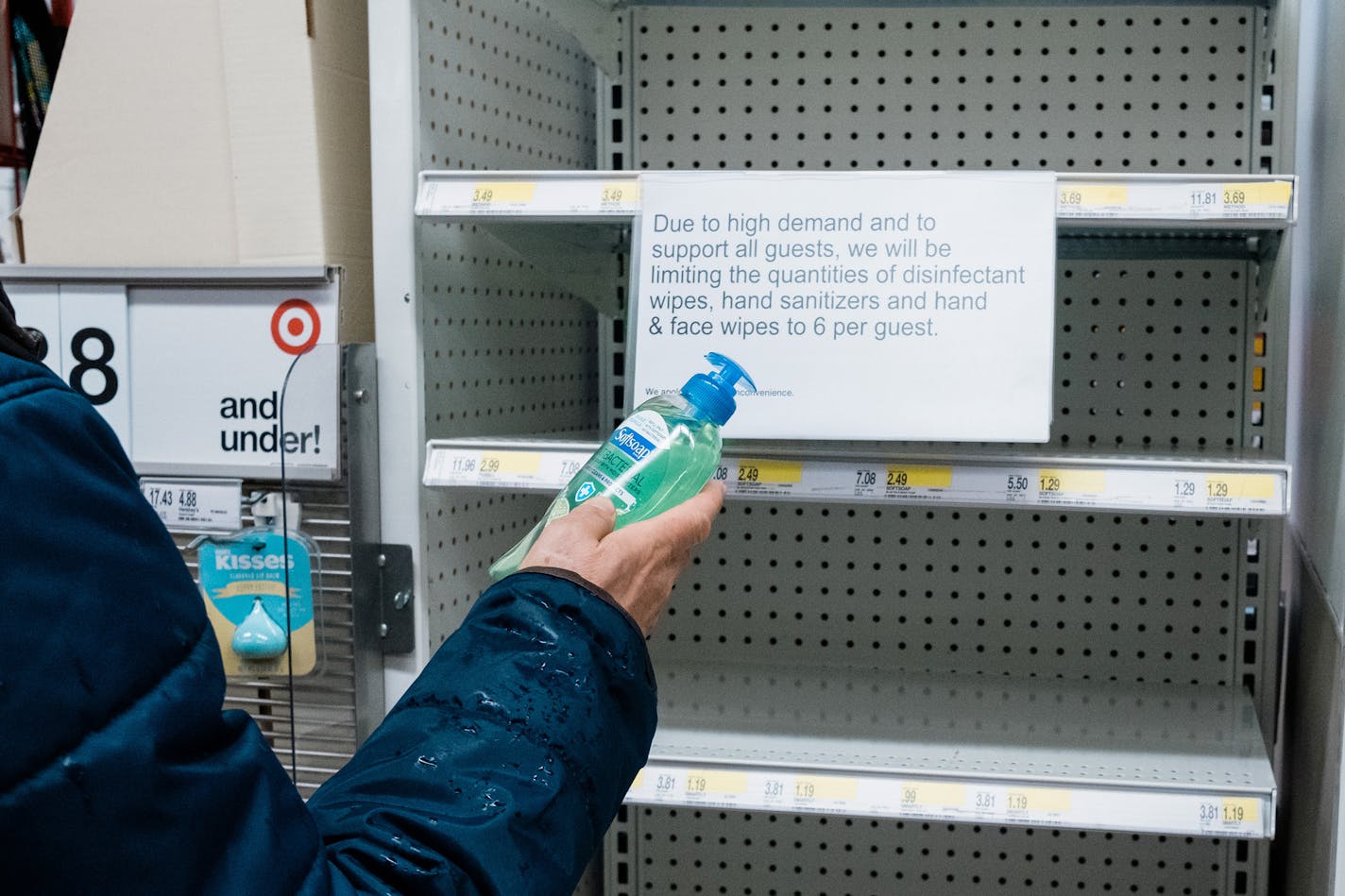 A man picks a single bottle of hand soap that was just placed on the shelves in a New York store, Friday, March 13, 2020. A day after New York officials declared a state of emergency, hordes of shoppers flooded stores and emptied shelves, looking to stockpile groceries and household items to prepare for the unknown. (Gabriela Bhaskar/The New York Times)