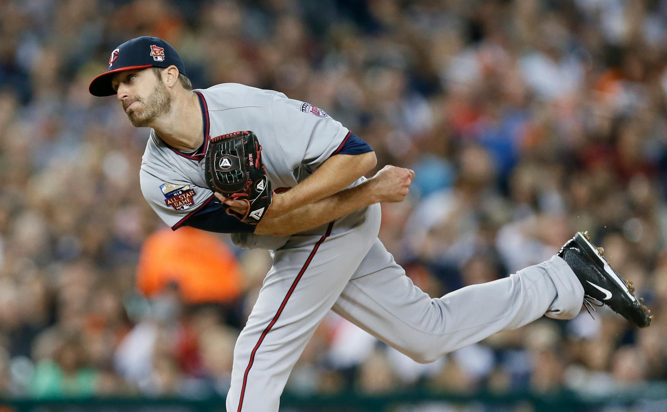 Minnesota Twins relief pitcher A.J. Achter throws against the Detroit Tigers in the fifth inning of a baseball game in Detroit Friday, Sept. 26, 2014. (AP Photo/Paul Sancya)