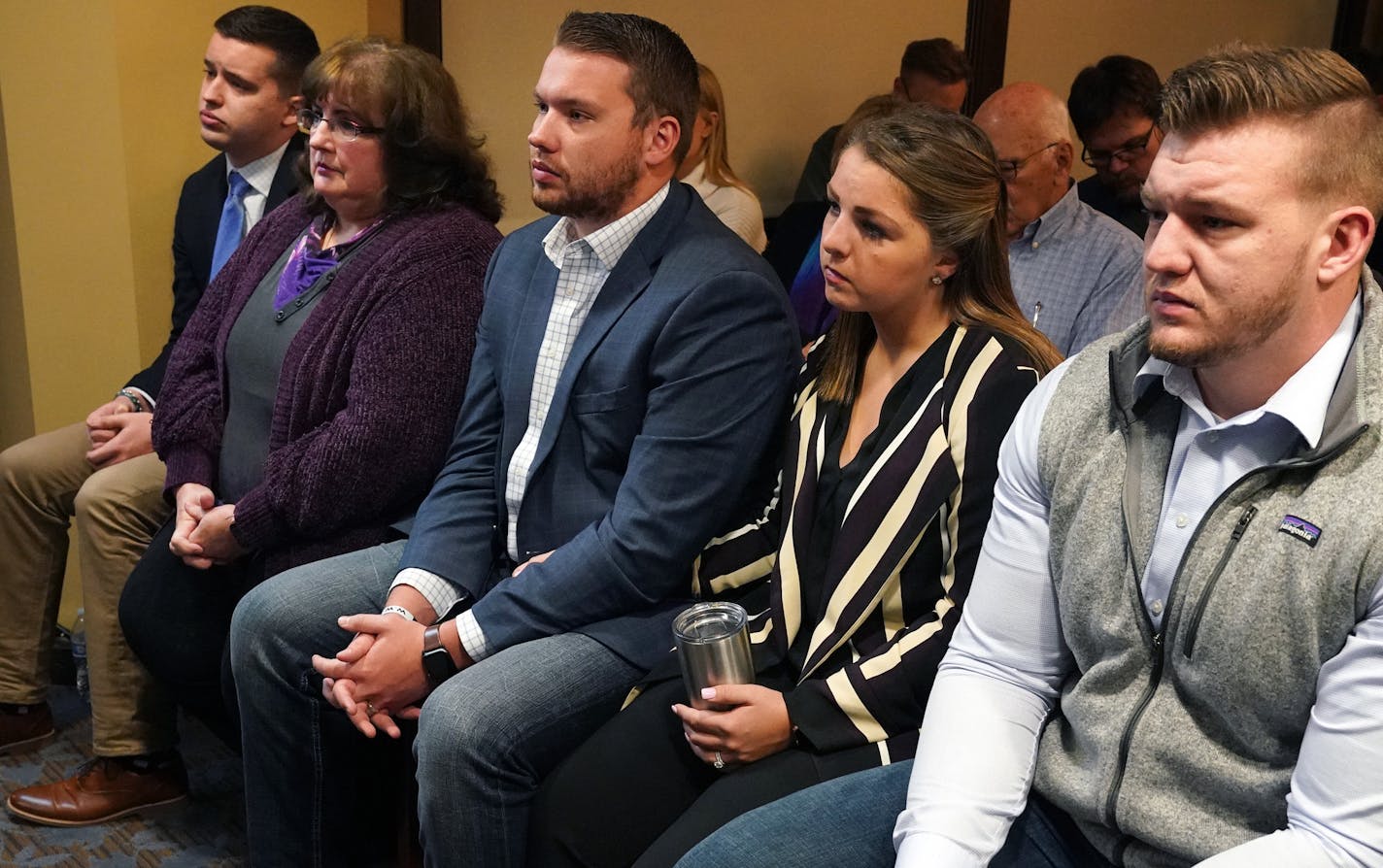 Joy Hoffman, second from left, sat with her sons who were victimized by former priest Curtis Wehmeyer, from left, Ben, Luke, Luke's wife Danielle, and Stephen during a press conference after submitting their final progress report on tightened clergy abuse protocols to a Ramsey County District judge Tuesday. ] ANTHONY SOUFFLE &#x2022; anthony.souffle@startribune.com Ramsey County District Attorney Jon Choi and Archdiocese officials held a press conference after the Archdiocese of St. Paul and Min