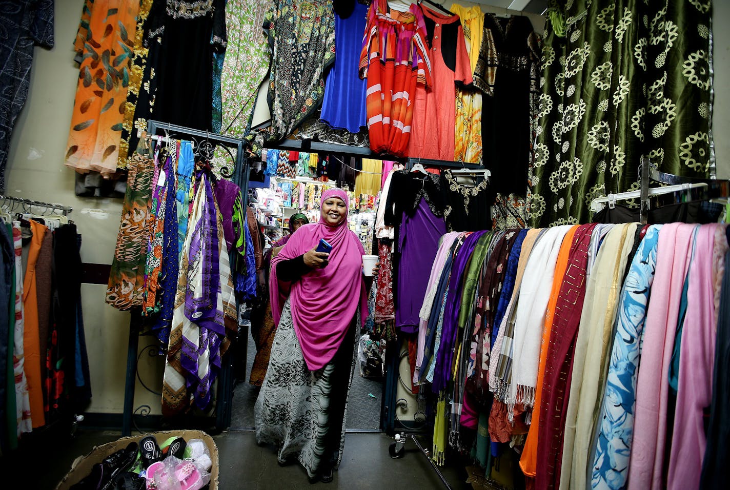 Halima Ahmed made her way through the Village Market mall in south Minneapolis, where she likes to shop for long dresses.