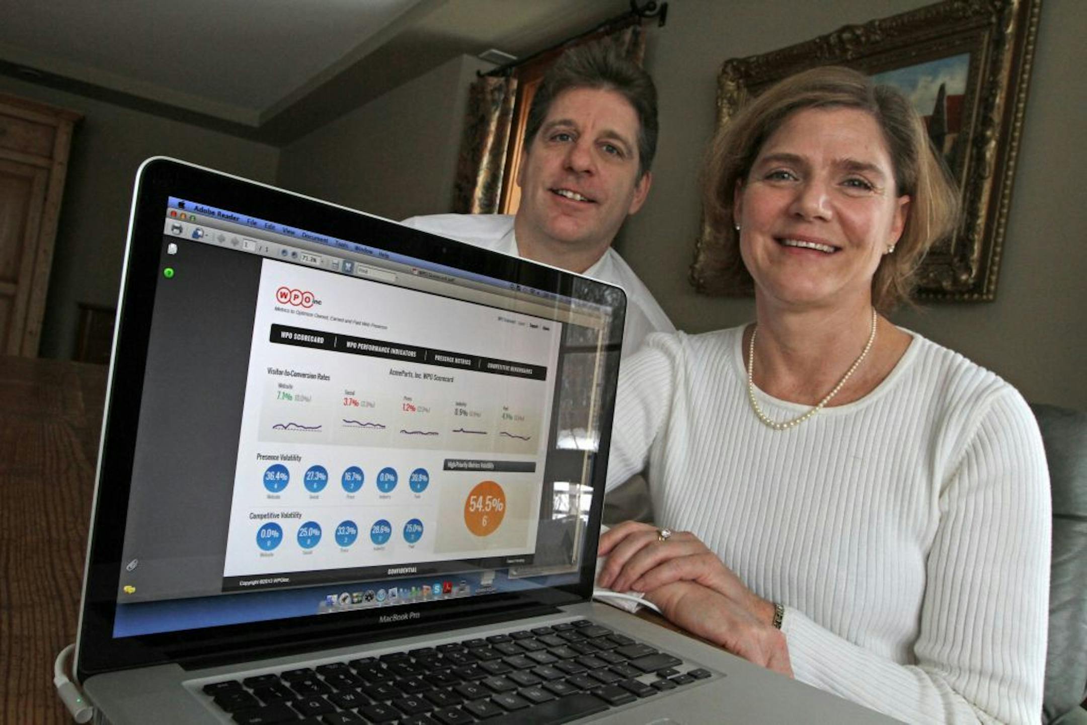WPO Inc. co-founders Tom Pick and Kirsten Chapman photographed with their company website on 1/29/13.