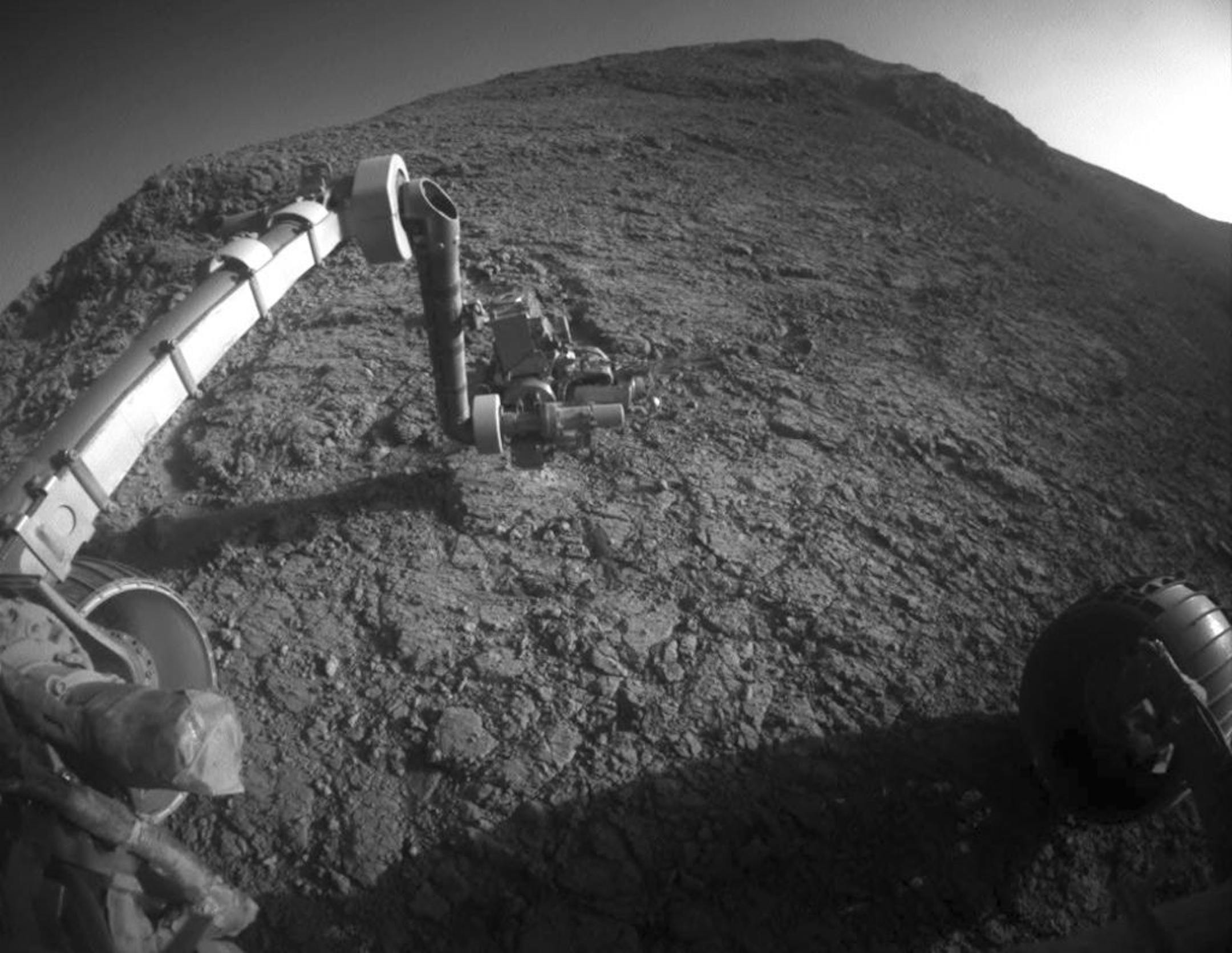 This Jan. 5, 2016 photo made available by NASA shows the tool turret at the end of the the Opportunity rover's robotic arm on the southern side of "Marathon Valley," which goes through the western rim of Endeavour Crater.