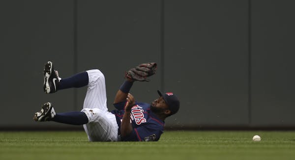 Twins center fielder Denard Span was injured while trying to make this catch against Tampa Bay on Aug. 12.
