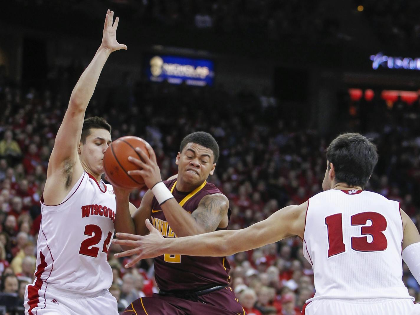 Gophers freshman Nate Mason, center, battled between Wisconsin's Bronson Koenig, left, and Duje Dukan (21) during a Feb. 21, 2015, game in Madison, Wis.