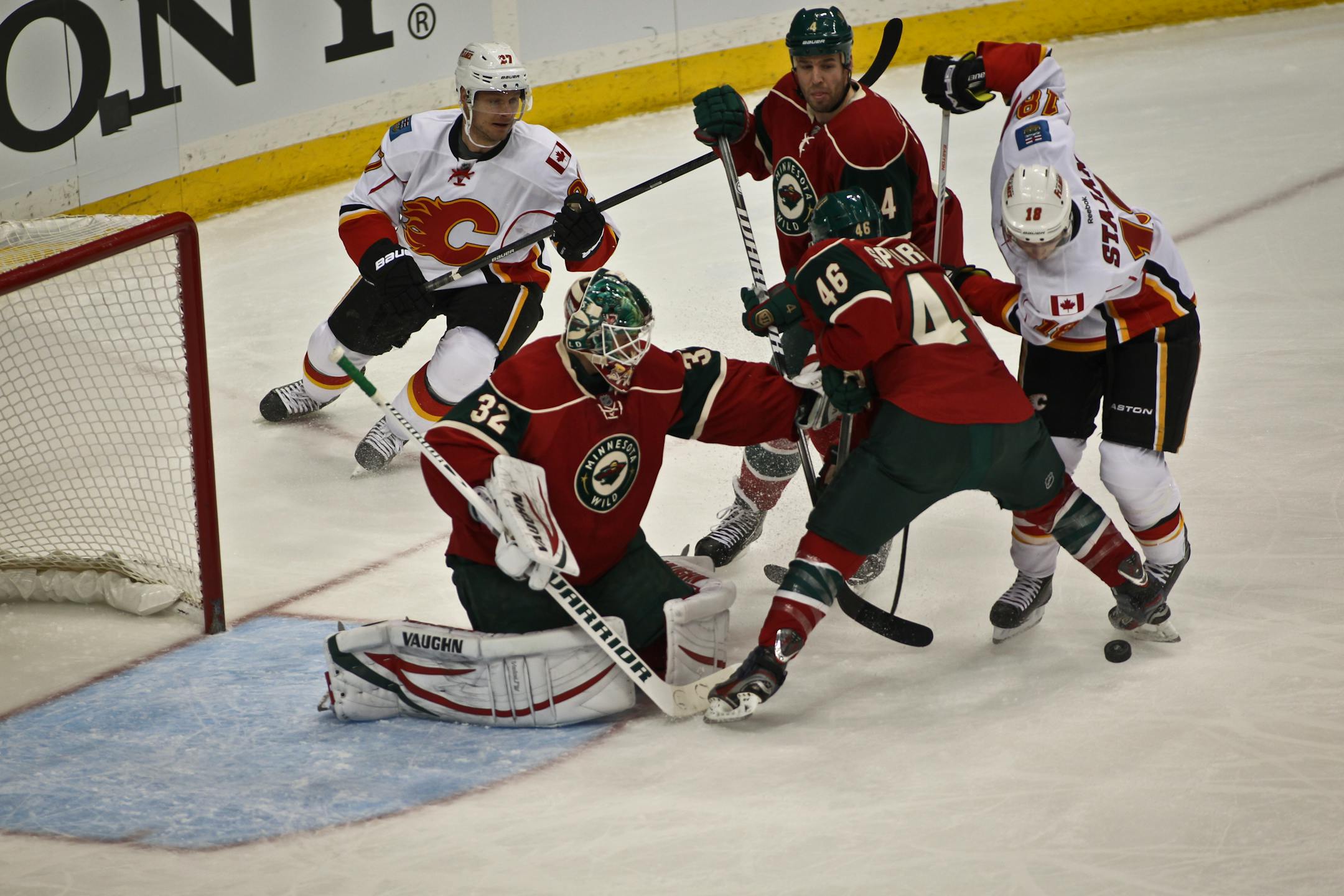 Wild goalie Niklas Backstrom had plenty of help from Jared Spurgeon (46) and Clayton Stoner (4) as Calgary's Matt Stajan went for a shot in Minnesota's victory Tuesday at the Xcel Energy Center.