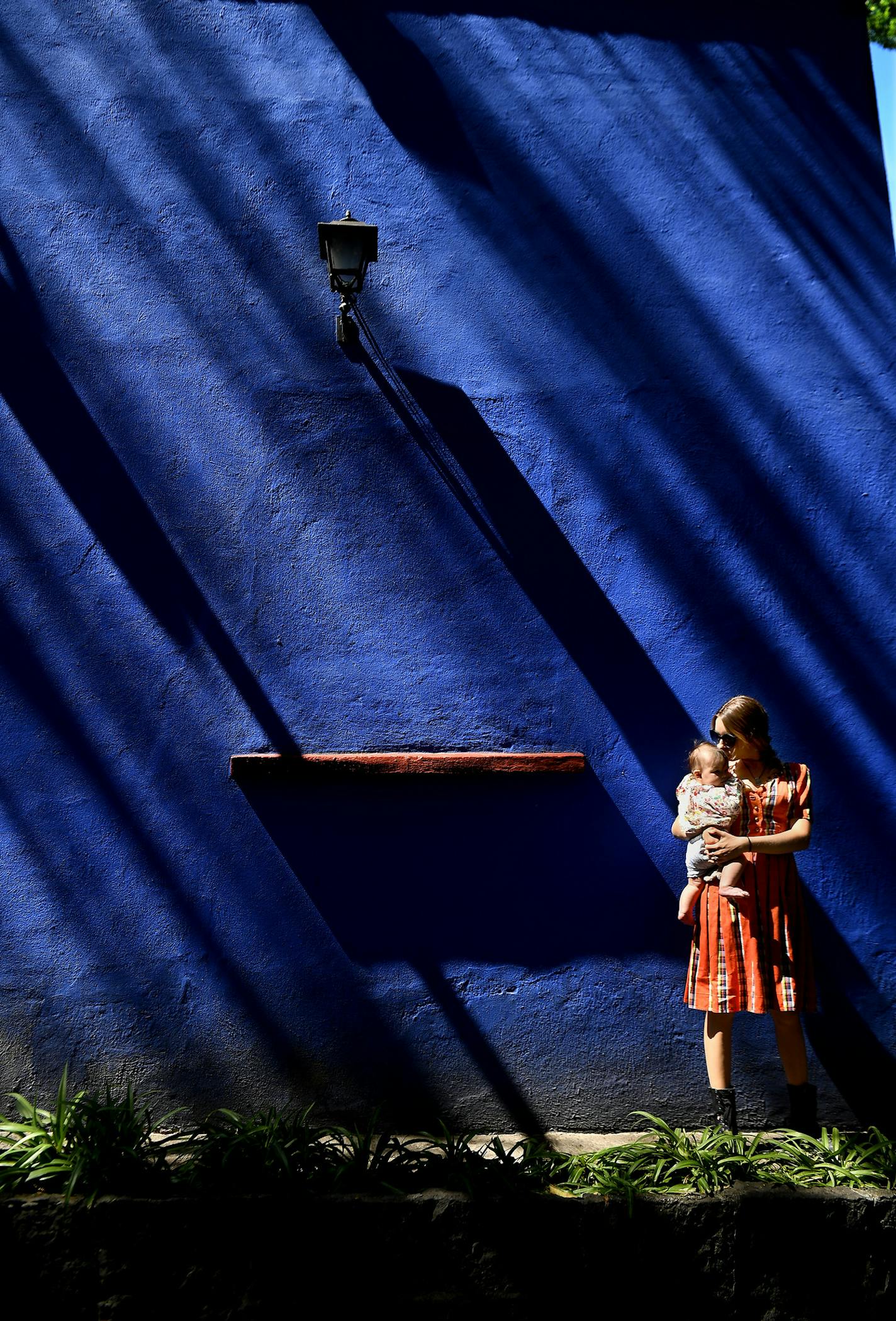 Visitor Elizabeth Flynn holds her baby Earth in the courtyard of the Frida House in Mexico City on February 16, 2018. (Wally Skalij/Los Angeles Times/TNS) ORG XMIT: 1242223