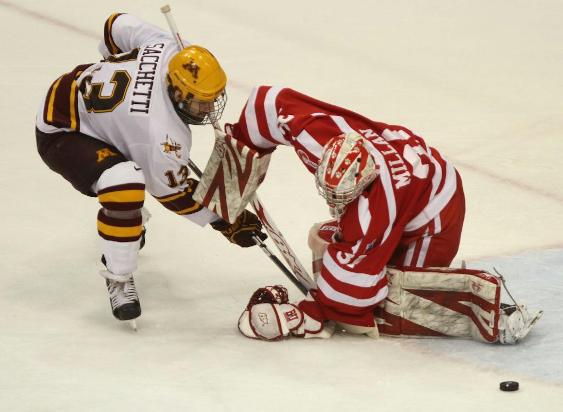 NCAA Frozen Four West Regionals, University of Minnesota vs. Boston University, Xcel Center, 3/24/12. (left to right) Gopher's Nico Sacchetti's shot was blocked by Boston U goalie Kieran Millan in 2nd period action.
