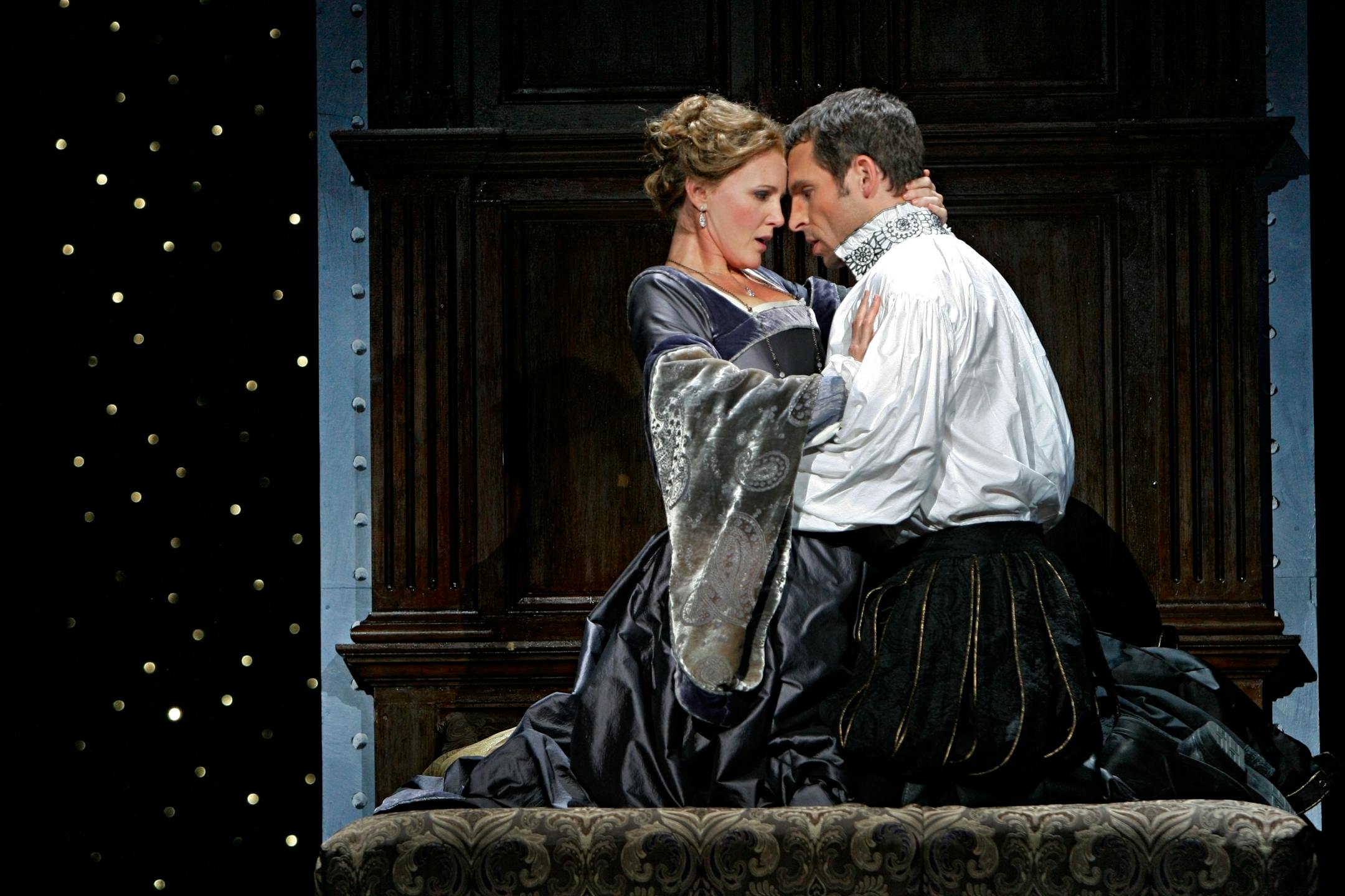 Giovanna Seymour, Anna's lady-in-waiting (Lauren McNeese) and Enrico VIII, King of England (Kyle Ketelsen) in the Minnesota Opera production of "Anna Bolena."