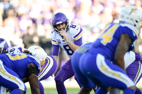 Minnesota Vikings quarterback Kirk Cousins in action during the second half of an NFL football game against the Los Angeles Chargers in Carson, Calif.