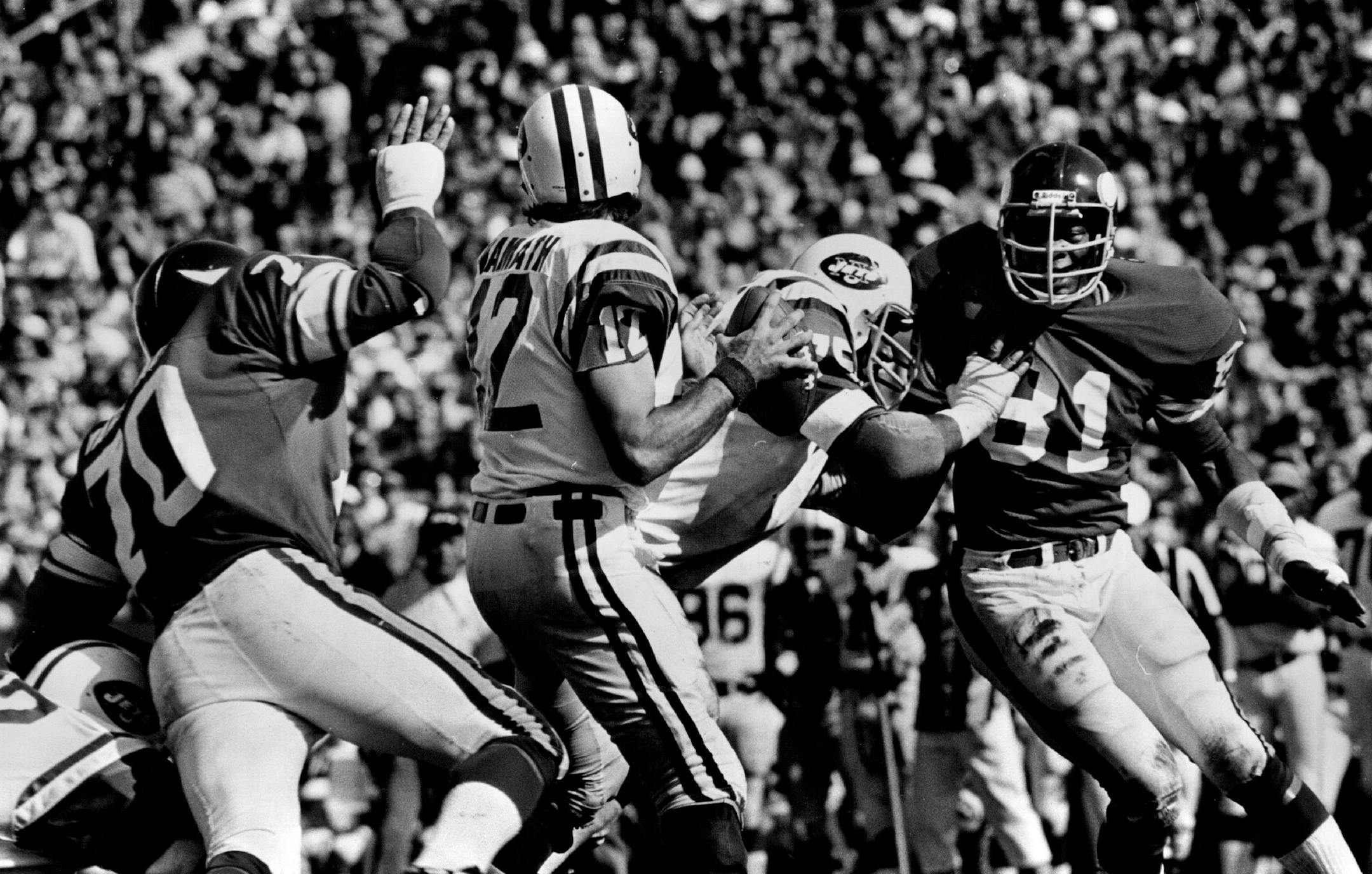 October 13, 1975: Jets quarterback Joe Namath set up to pass, unaware of Vikings end Jim Marshall behind him.