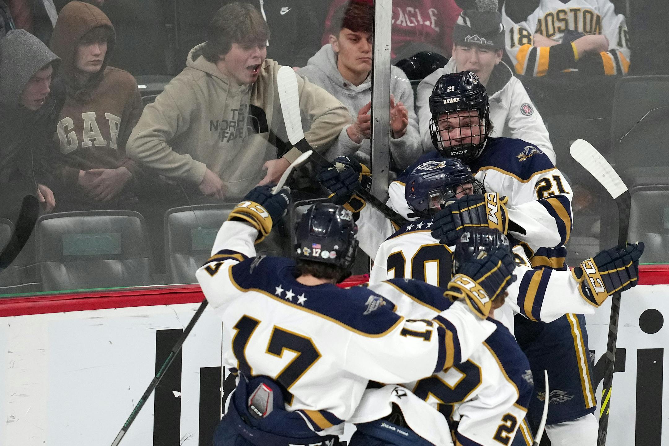 Hermantown forward Joshua Kauppinen (20) is mobbed by his teammates after scoring in the first period of a MSHSL Class 4A semifinal boys hockey game between Hermantown and Alexandria Friday, March 11, 2022 at the Xcel Energy Center in St. Paul, Minn. ] ANTHONY SOUFFLE • anthony.souffle@startribune.com