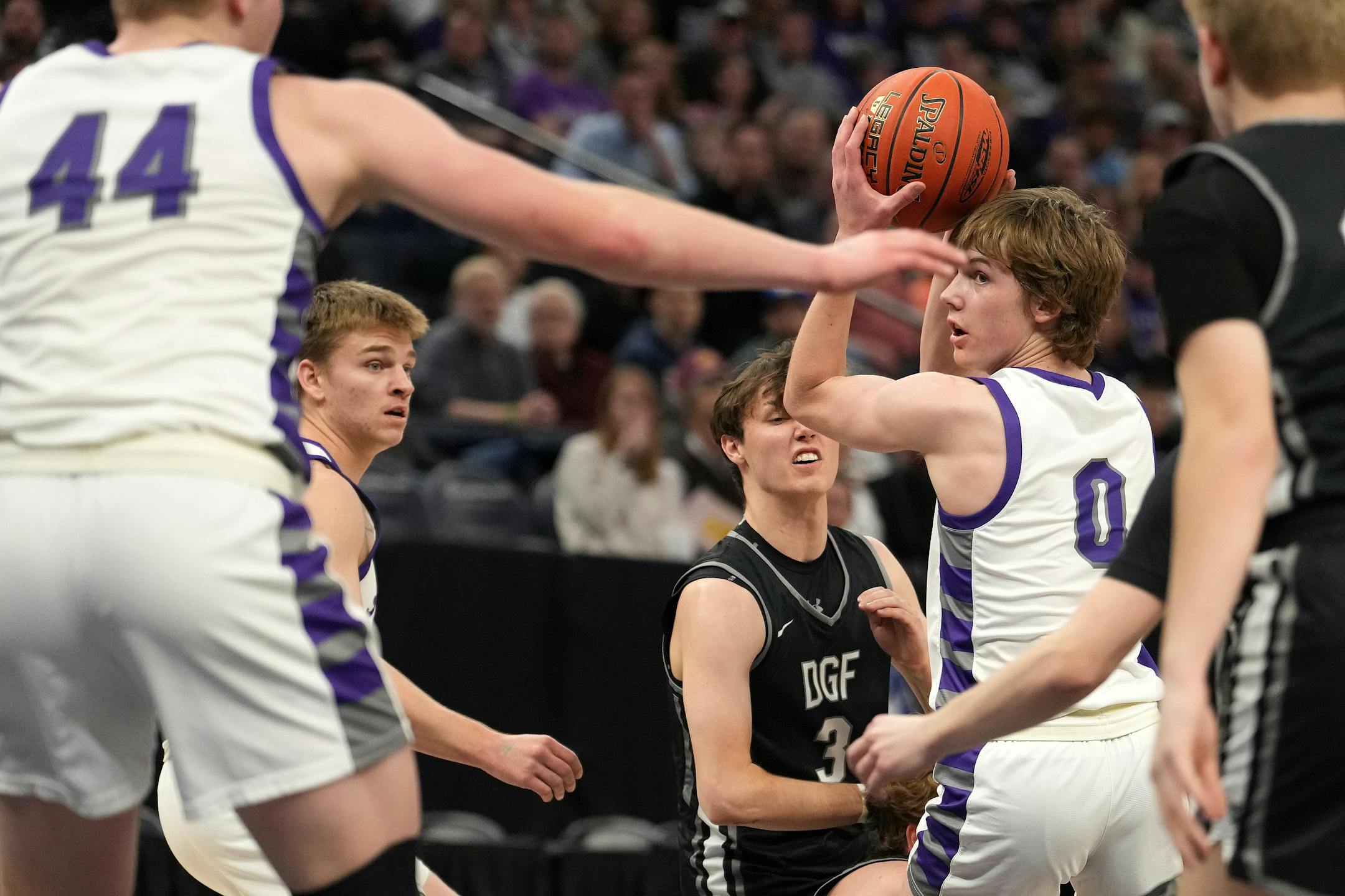Albany guard Zeke Austin (0) looks for an open teammate to pass to in the first half.