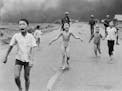 FILE - In this June 8, 1972 file photo, South Vietnamese forces follow after terrified children, including 9-year-old Kim Phuc, center, as they run do