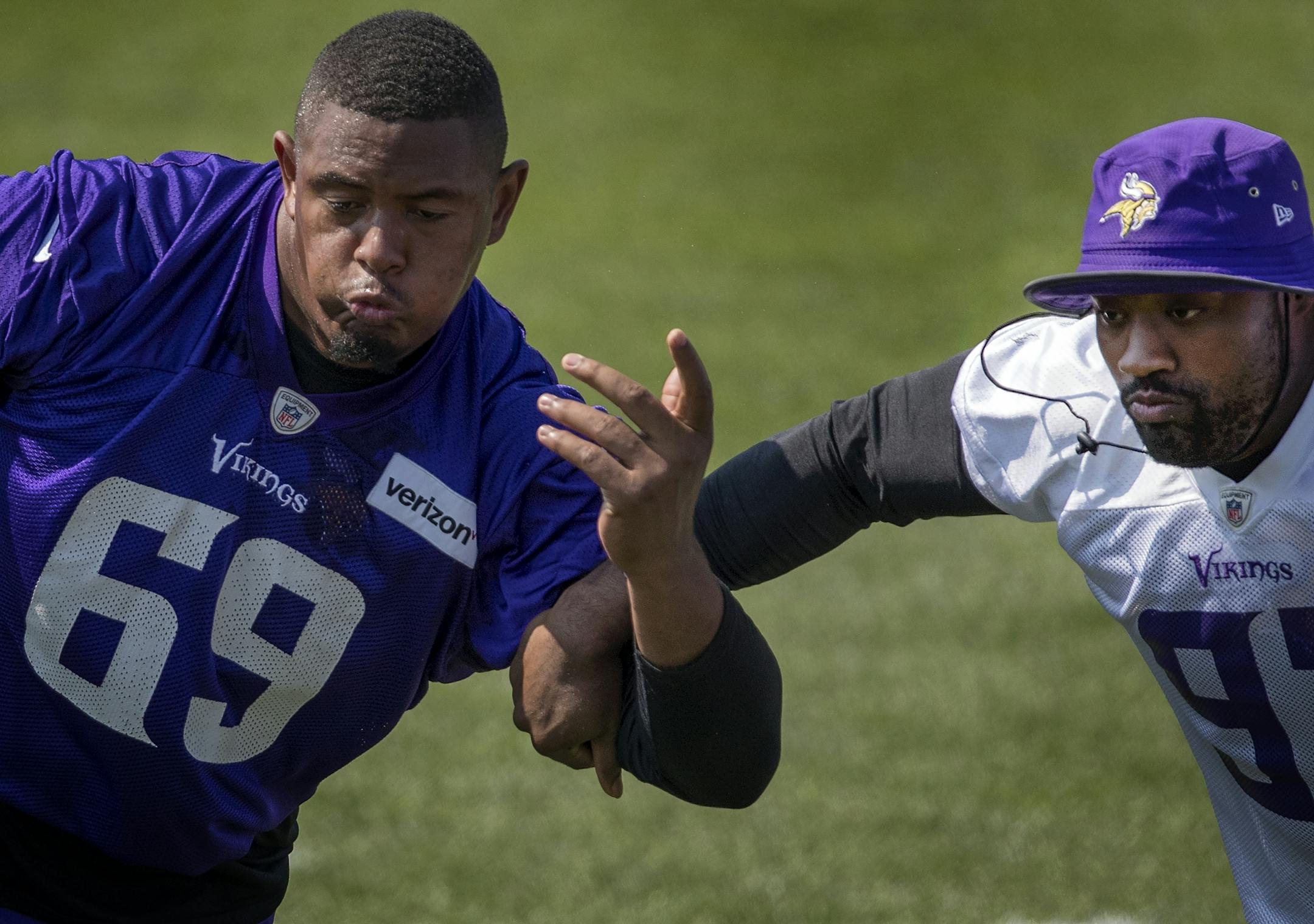 Minnesota Vikings offensive lineman Rashod Hill (69) blocked Everson Griffen (97) during the morning practice.