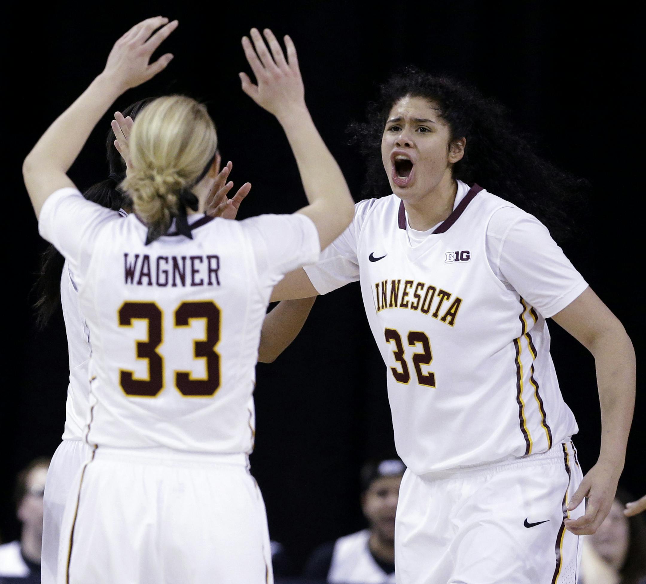 Minnesota center Amanda Zahui, right, celebrates with guard Carlie Wagner after Purdue guard Andreona Keys missed a pass during the second half of an NCAA college basketball game in the Big Ten women's tournament in Hoffman Estates, Ill., on Thursday, March 5, 2015. Minnesota won 82-78. (AP Photo/Nam Y. Huh)