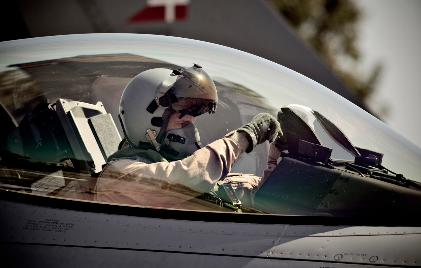 A Danish F-16 pilot prepares to leave to patrol the sky over Libya at Signella Airbase in Sicily, Italy, Tuesday April 5, 2011. Britain, France and other NATO allies are providing fighter jets for intercept and ground-attack missions that enforce a no-fly zone over Libya. A U.N.-mandated no-fly zone and international airstrikes began March 19 against the forces of longtime Libyan ruler Moammar Gadhafi. (AP Photo/Joachim Adrian) DENMARK OUT