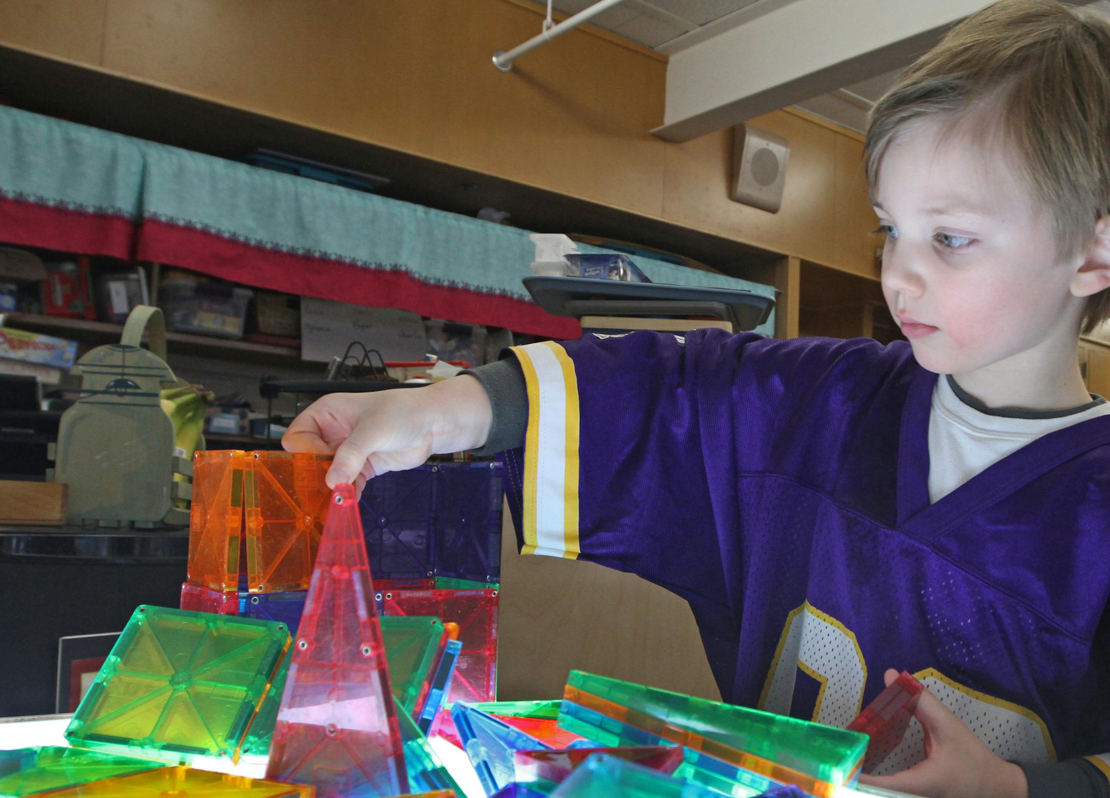 (right) Noah Carr worked with plastic building blocks placed on a light table, during Lucy Lyons preschool class at Glen Lake Elementary School in Hopkins on 1/16/13. Preschoolers in Hopkins this year are learning the basic vocabulary of engineering -- one of the few programs in the state and country starting science, engineering, technology and math, or STEM, at such an early age. In the last few years, STEM programs have increased across Minnesota schools, mostly in middle schools. But in Hopk