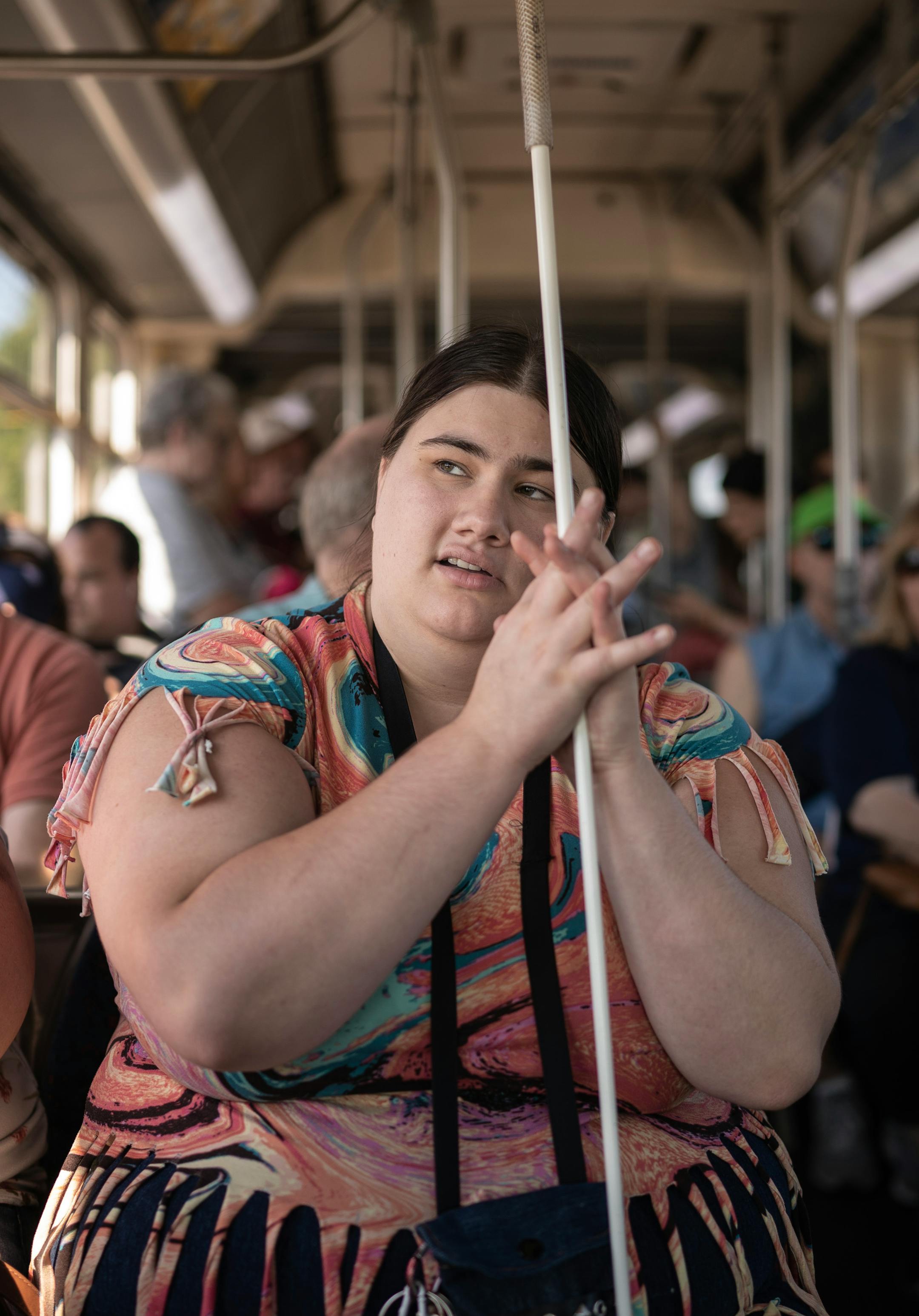 Harley Acy, a home management instructor at BLIND, Inc. took a city bus ride to the Minnesota State Fair. Paying attention to environmental cues such as the sun as well as the knowledge of the grid-like streets of the fairgrounds helps those who are blind navigate the fair.
