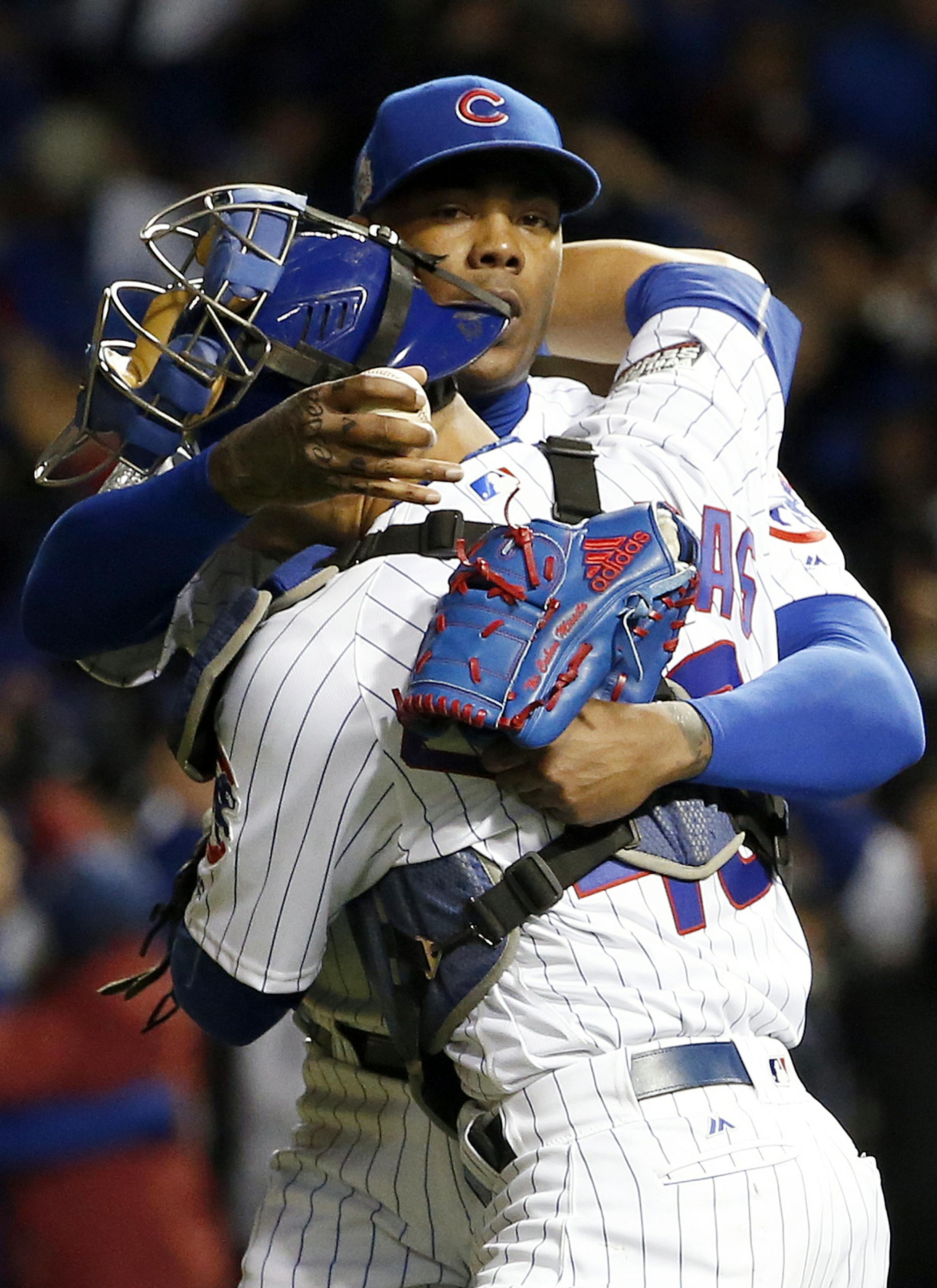 Chicago Cubs relief pitcher Aroldis Chapman and catcher Willson Contreras celebrate after Game 5 of the Major League Baseball World Series against the Cleveland Indians, Sunday, Oct. 30, 2016, in Chicago. The Cubs won 3-2 as the Indians lead the series 3-2. (AP Photo/Nam Y. Huh)