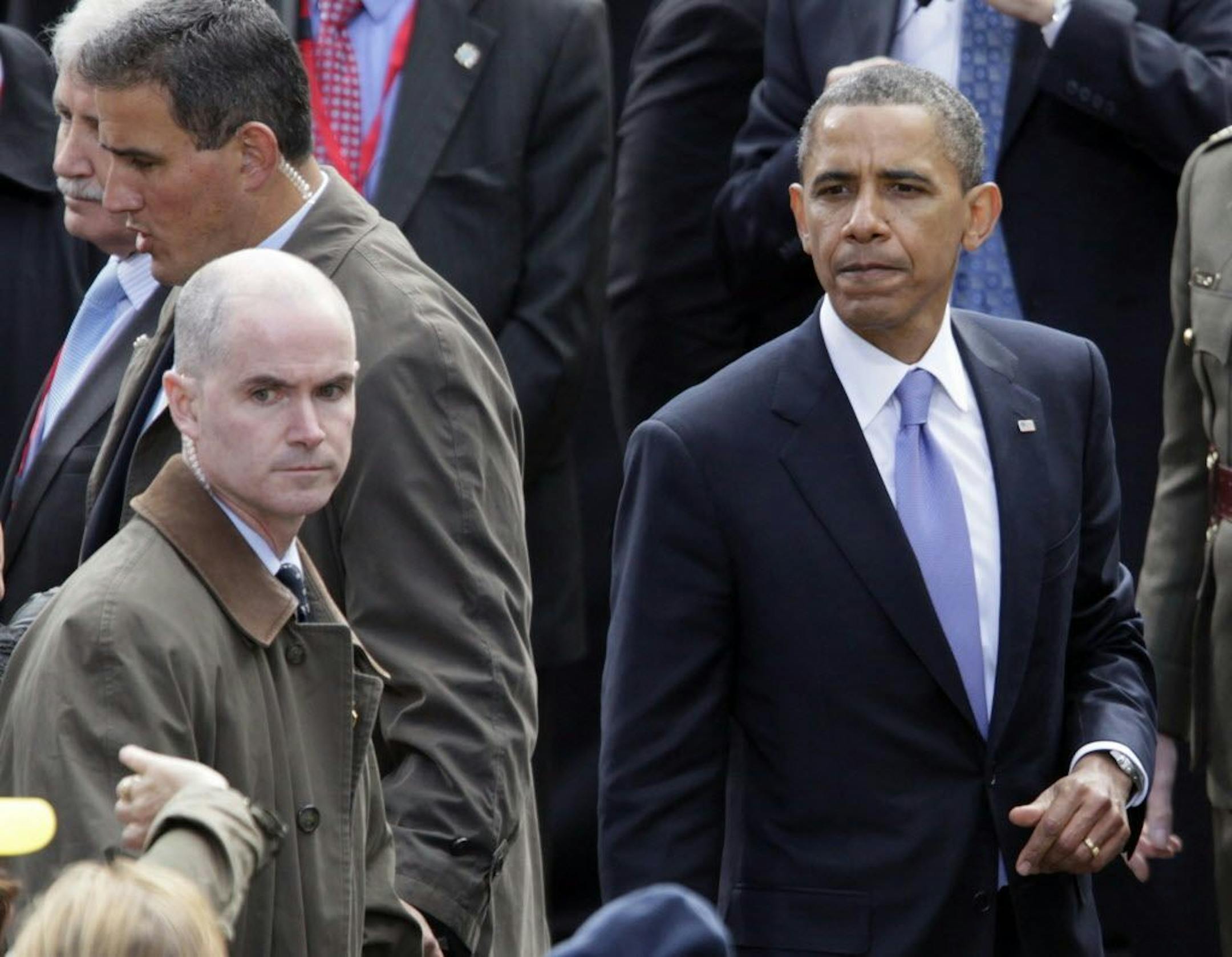 FILE - In this May 23, 2011 file photo, Mark Connolly, the second-in-command on President Barack Obama's security detail, at left, watches the crowd gathered to greet Obama in Dublin, Ireland.