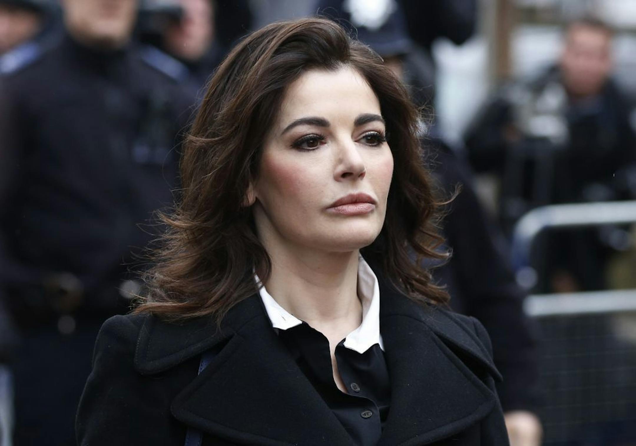 FILE - In this Wednesday, Dec. 4, 2013 file photo, celebrity chef, Nigella Lawson, arrives at Isleworth Crown Court in London. Two former assistants to Nigella Lawson and her former husband were acquitted of fraud Friday, Dec. 20, 2013 in London, capping a case where allegations of unauthorized spending on lavish goods were often overshadowed by titillating glimpses into the celebrity chef�s troubled home life.