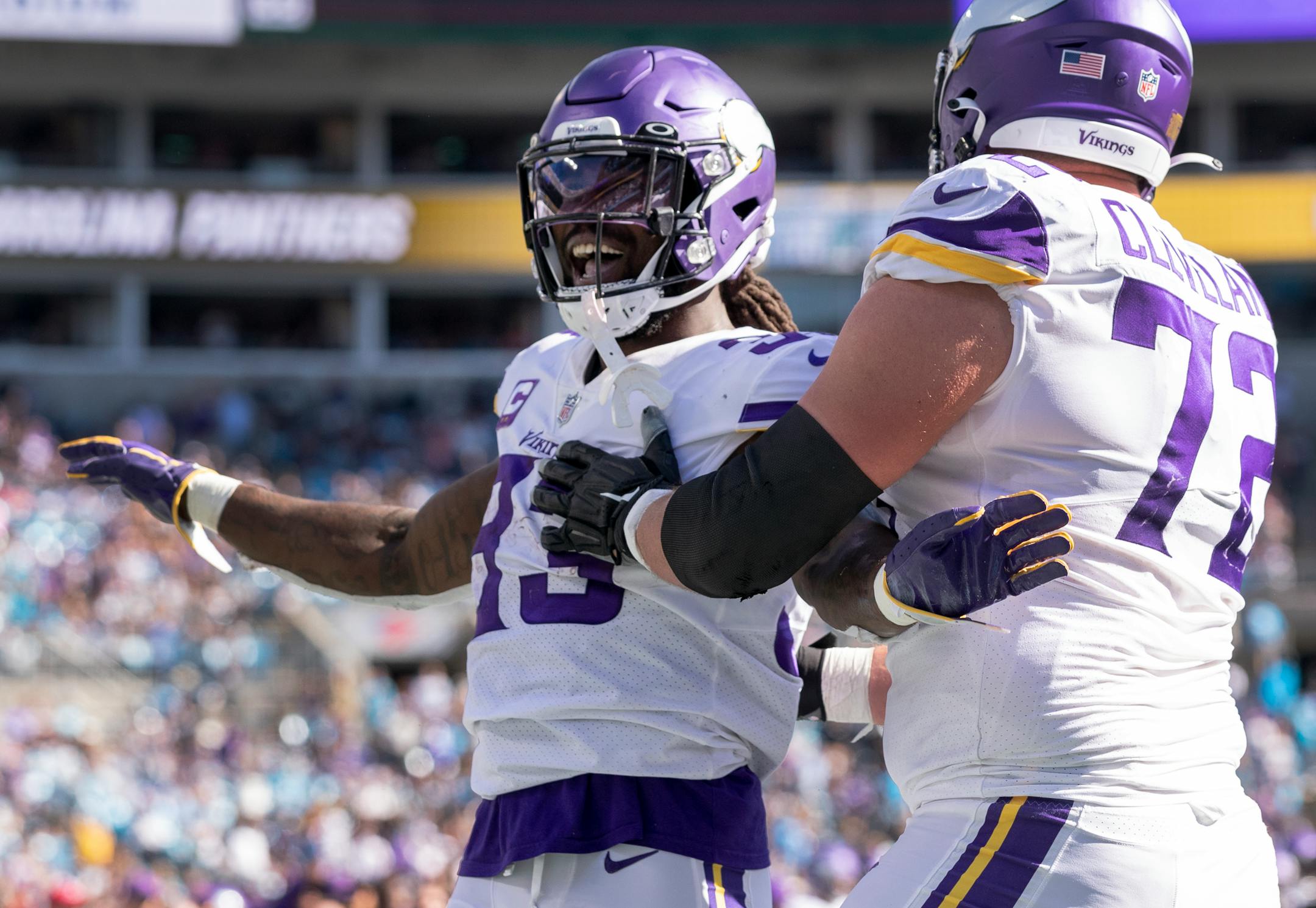 Minnesota Vikings running back Dalvin Cook (33) celebrated a touchdown with Ezra Cleveland (72) in the third quarter.