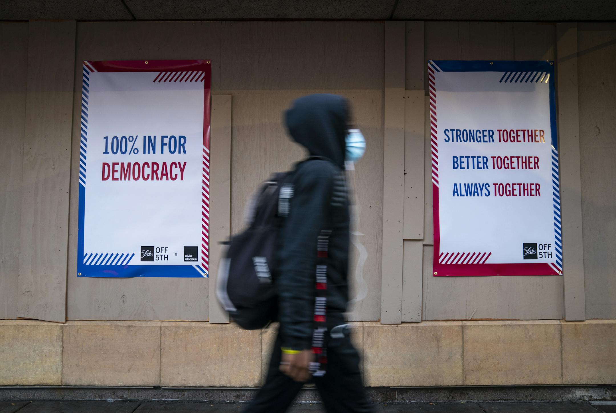Signs on the boarded-up windows outside Saks Fifth Avenue Off Fifth store in downtown Minneapolis. ] LEILA NAVIDI • leila.navidi@startribune.com BACKGROUND INFORMATION: Boarded-up buildings in downtown Minneapolis the day before the election on Monday, November 2, 2020.