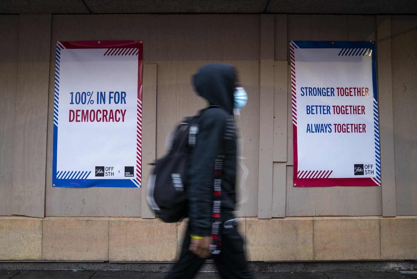 Signs on the boarded-up windows outside Saks Fifth Avenue Off Fifth store in downtown Minneapolis. ] LEILA NAVIDI • leila.navidi@startribune.com BACKGROUND INFORMATION: Boarded-up buildings in downtown Minneapolis the day before the election on Monday, November 2, 2020.