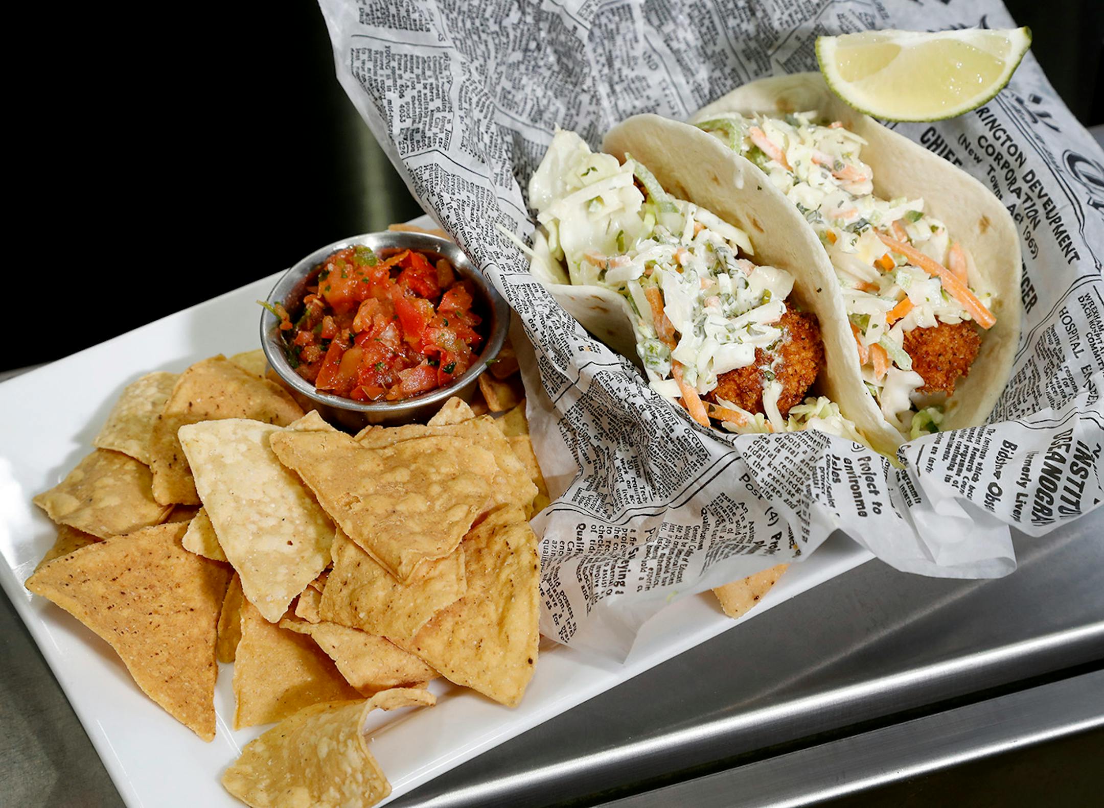 Superior Fish Tacos. Seasoned panko crusted of pan broiled fish, cilantro lime rice, jicama slaw, and cilantro lime cream sauce in soft flour tortillas at Canal Park Brewing Company in Duluth.