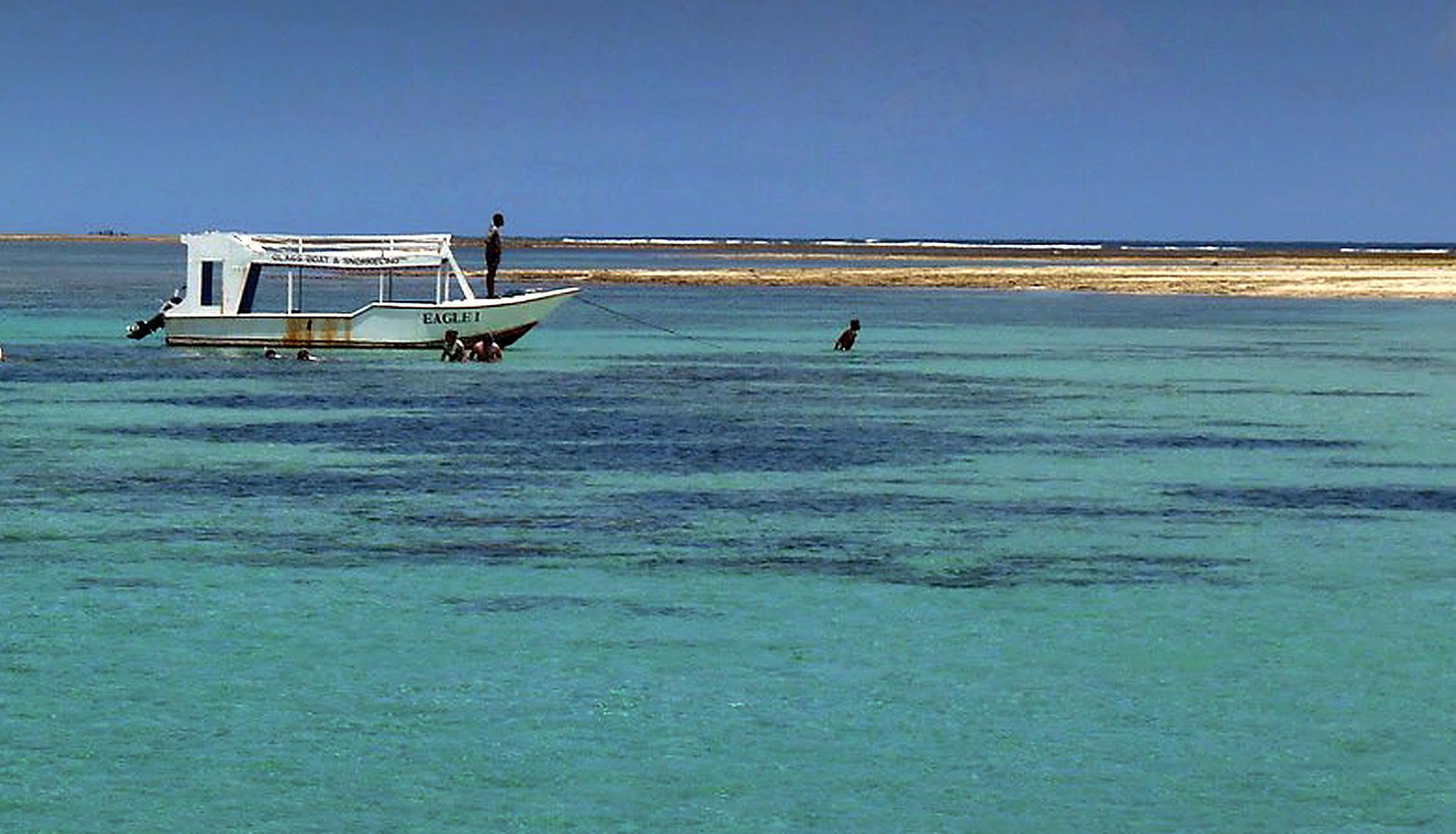 Boats offer tourists rides out to a sandbar and reef in Diani, Kenya to go snorkeling in the Indian Ocean. Standard caption: Diani beach in Kenya is a popular draw for tourists, kitesurfers and snorkelers, drawn to the African coastís white sandy beaches and bright turquoise waters. ] Budget ID: 235256 Slug: 235256 DIANITR011016 Budget line: This is the Indian Ocean coast of Kenya ó a vibrant, stunning side of the African country that doesnít often make the cover of travel books o